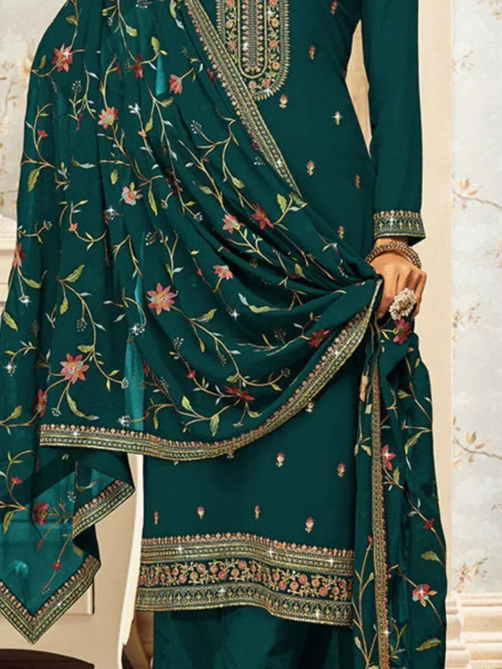 Dark green embroidered salwar kameez with floral design and matching dupatta