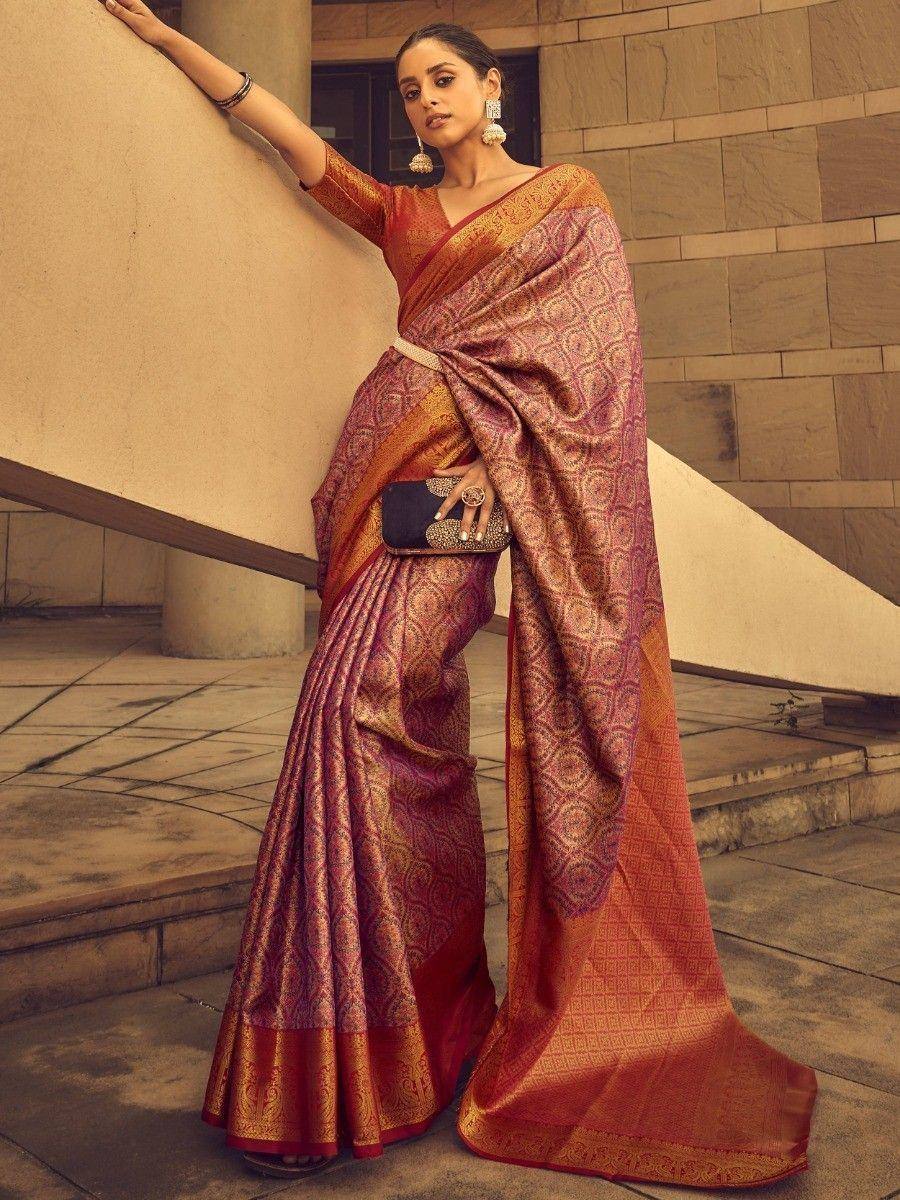 Elegant maroon and gold designer saree with intricate patterns, perfect for Indian ethnic occasions