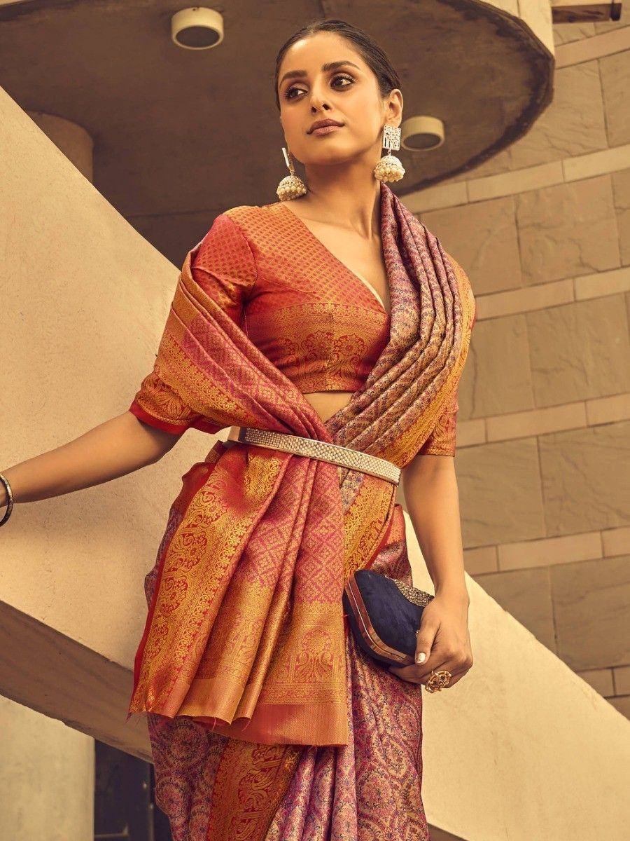 Woman in designer saree with blouse, ethnic wear for Indian occasions, rich embroidery and vibrant colors