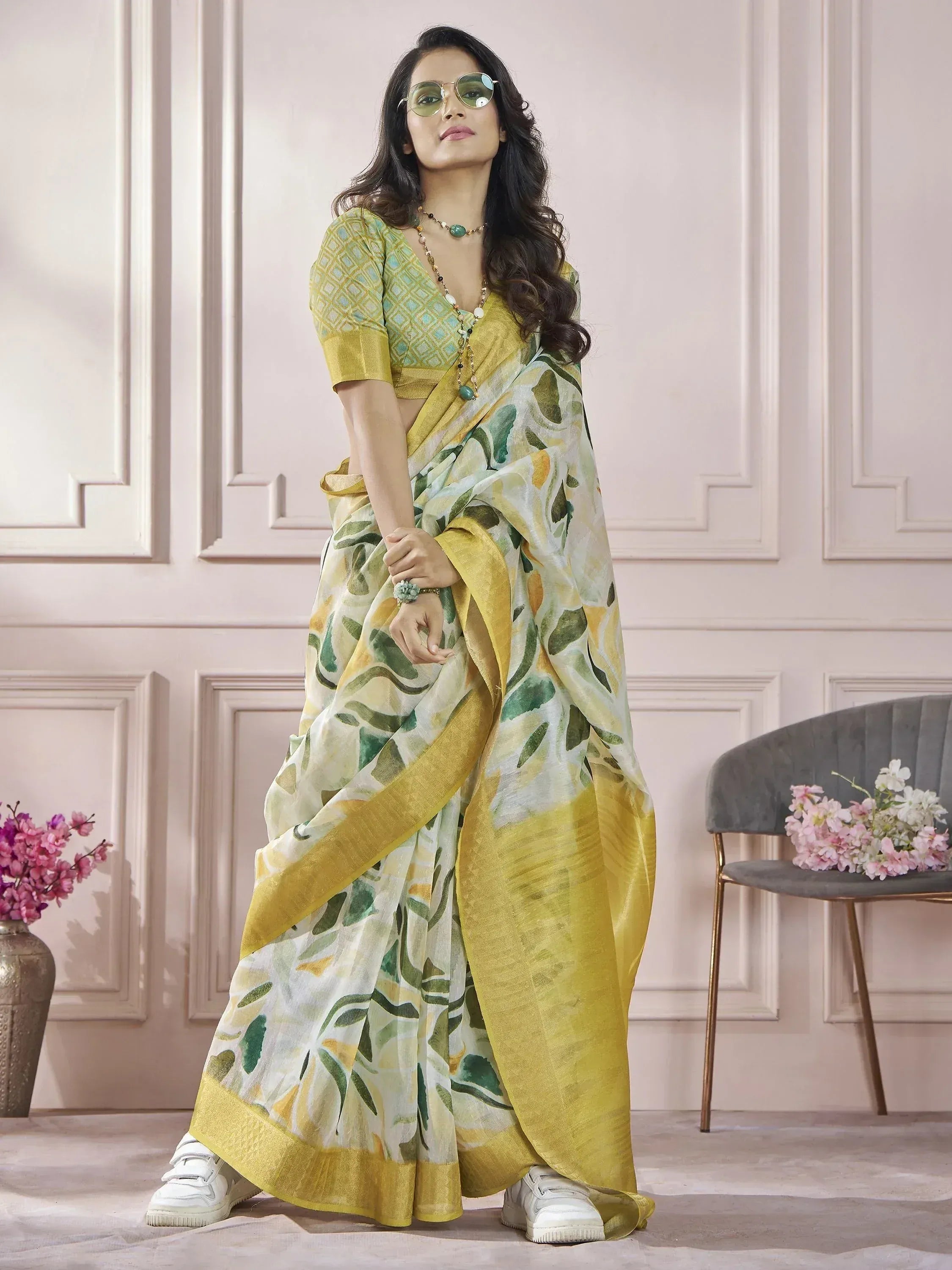 Yellow green floral print saree with matching blouse, styled with sneakers for modern ethnic look