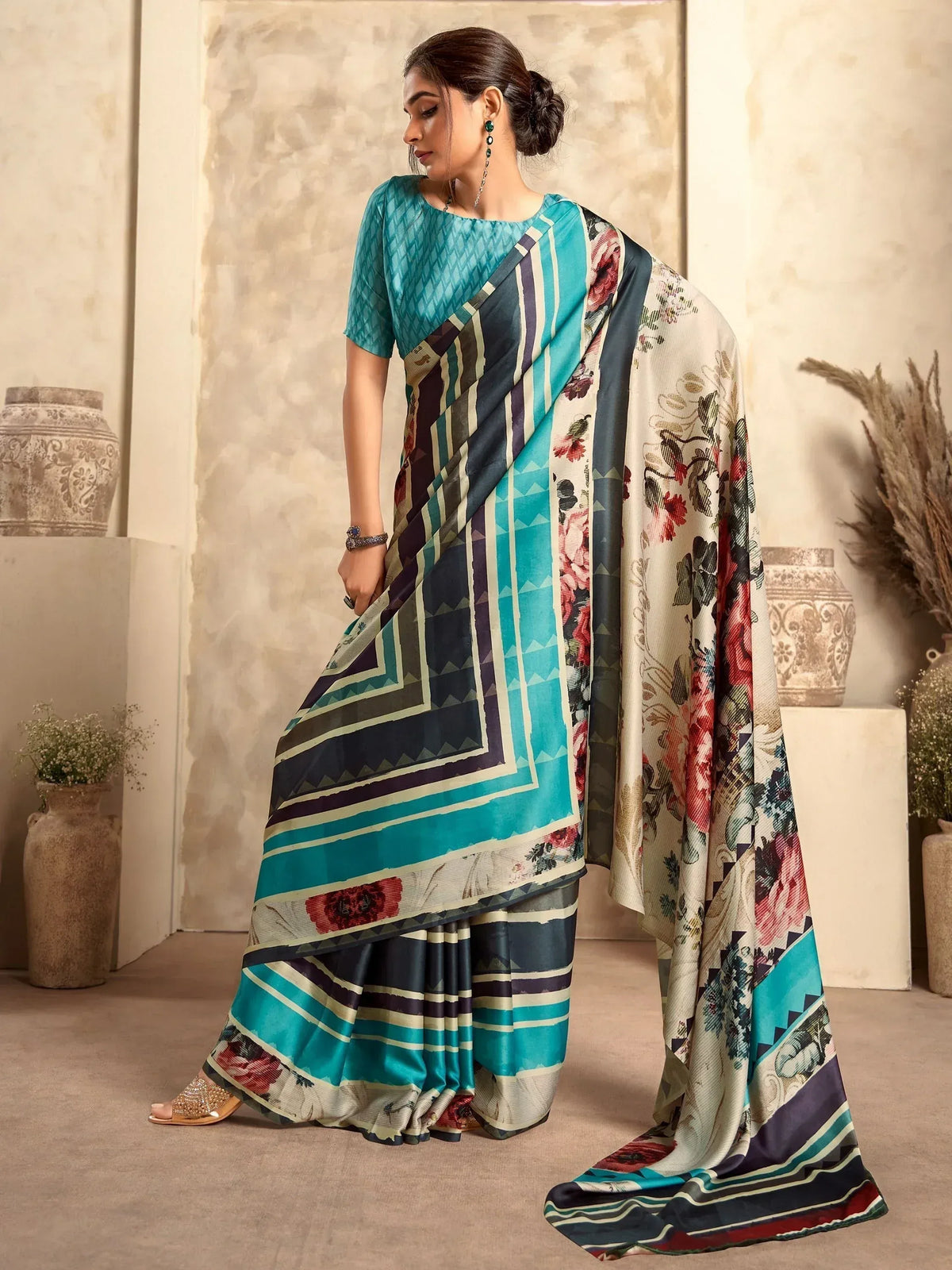 Woman in designer saree with floral and geometric print, ethnic wear for festive occasions