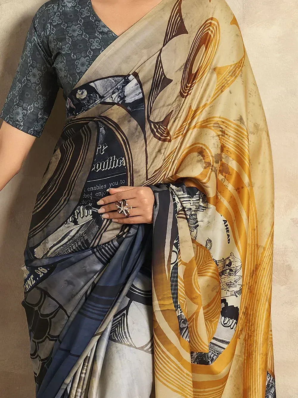 Stylish printed saree with abstract art and text design, paired with patterned blouse for ethnic wear