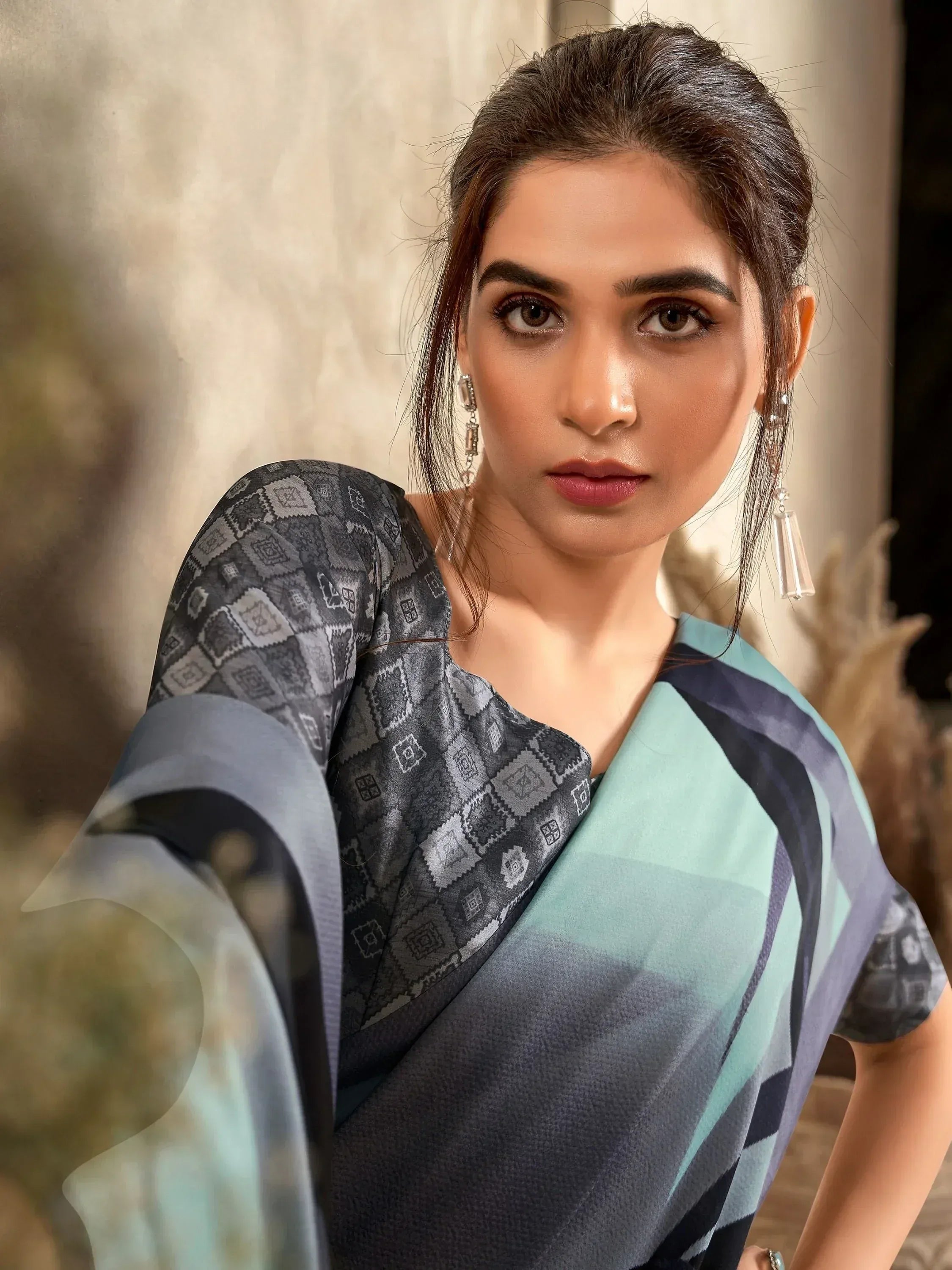 Woman in stylish ethnic saree with geometric print and modern blouse, perfect for Indian occasions