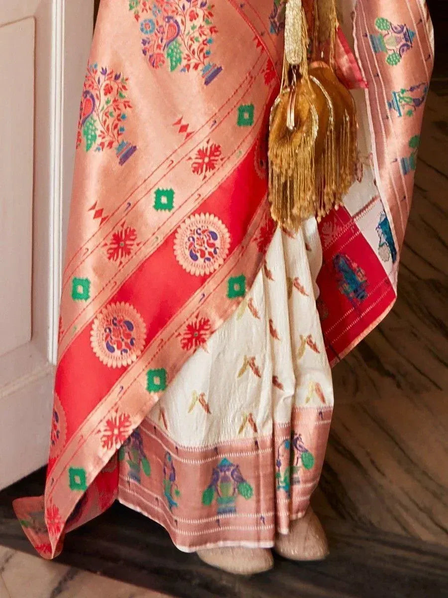 Colorful Indian ethnic saree with peacock and floral embroidery, gold tassels, and traditional border designs