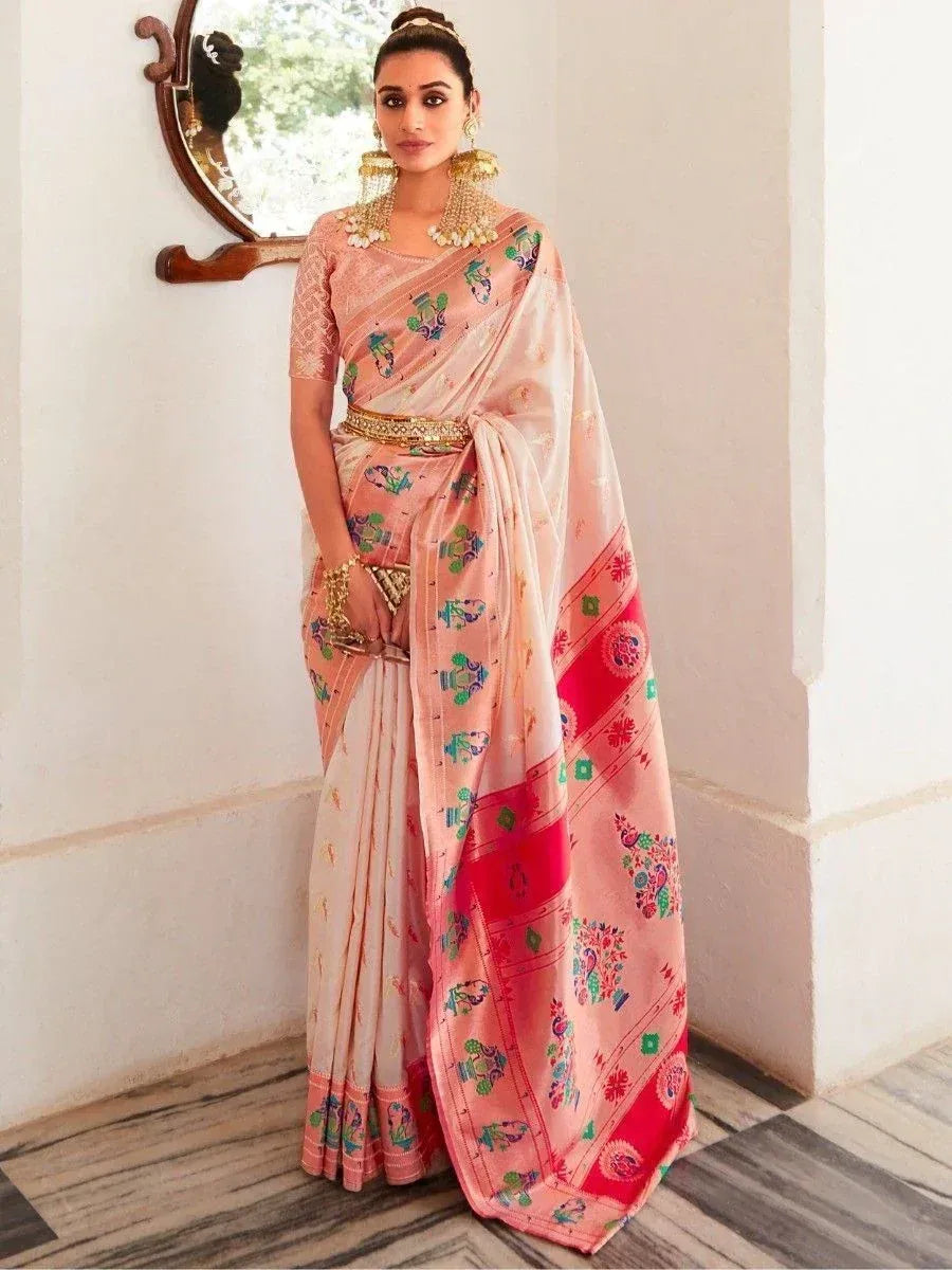 Woman in pink printed saree with gold belt and traditional jewelry, Indian ethnic wear