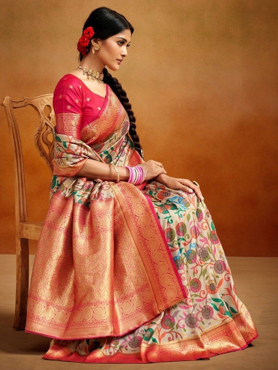Woman in vibrant floral saree with pink blouse, traditional Indian ethnic wear, perfect for festive occasions.