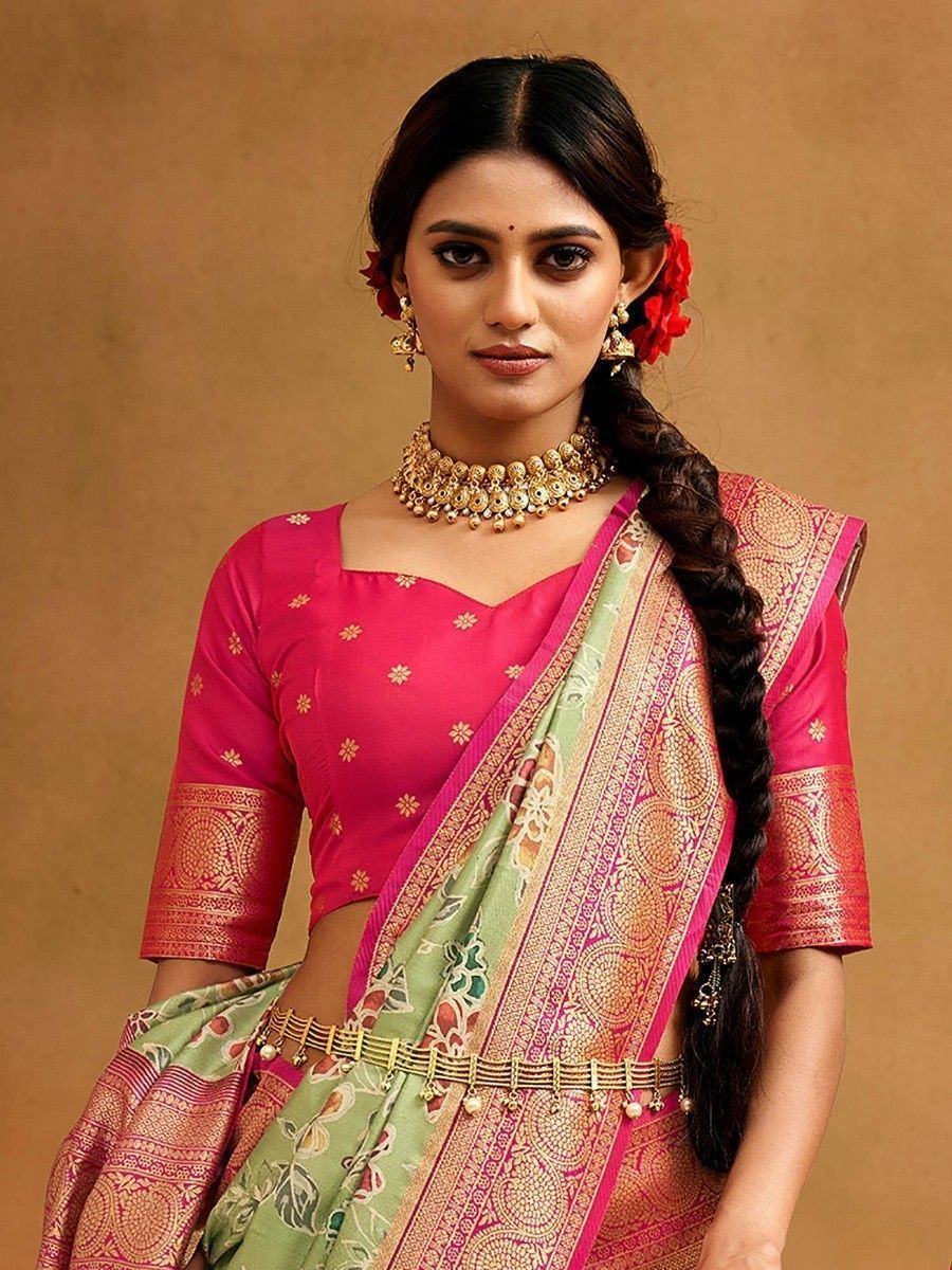 Woman in pink and green designer saree with gold embroidery, traditional Indian ethnic wear