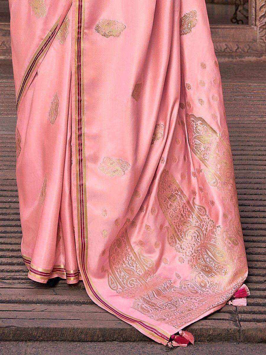 Pink silk saree with gold paisley embroidery and tassels, ideal for Indian ethnic occasions