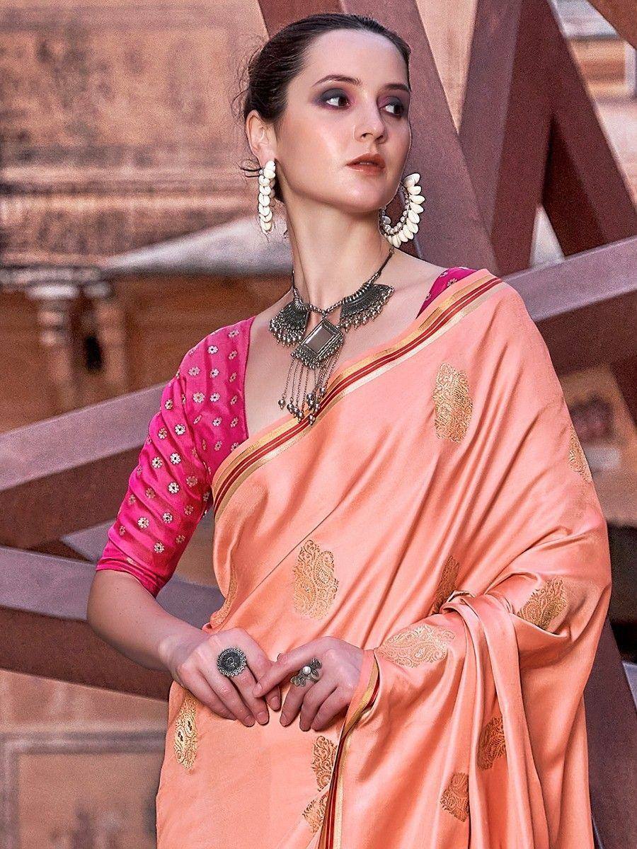 Peach silk saree with gold embroidery and pink blouse, styled with ethnic jewelry for Indian occasions