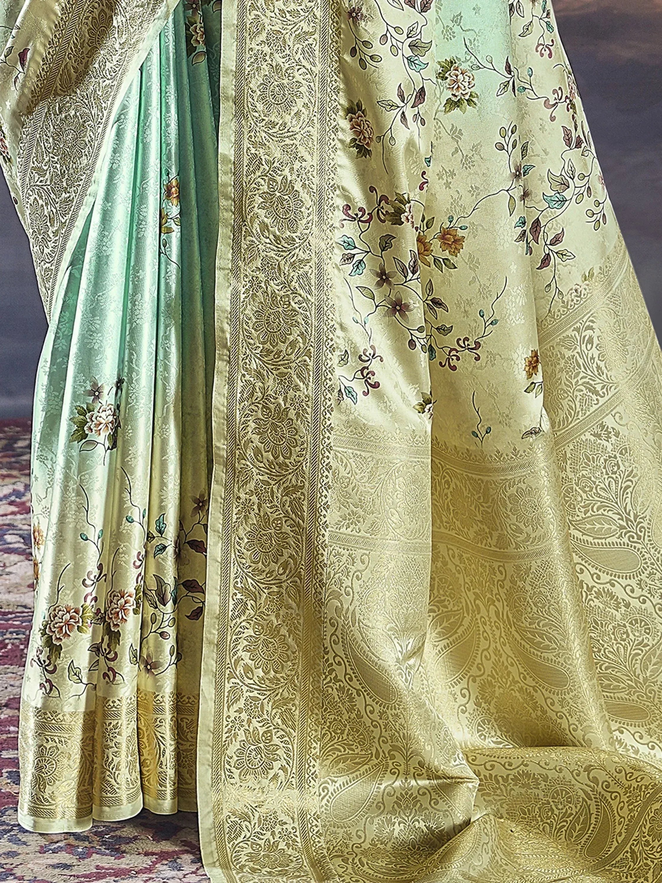 Elegant green and gold floral saree with intricate paisley border, perfect for Indian ethnic wear.