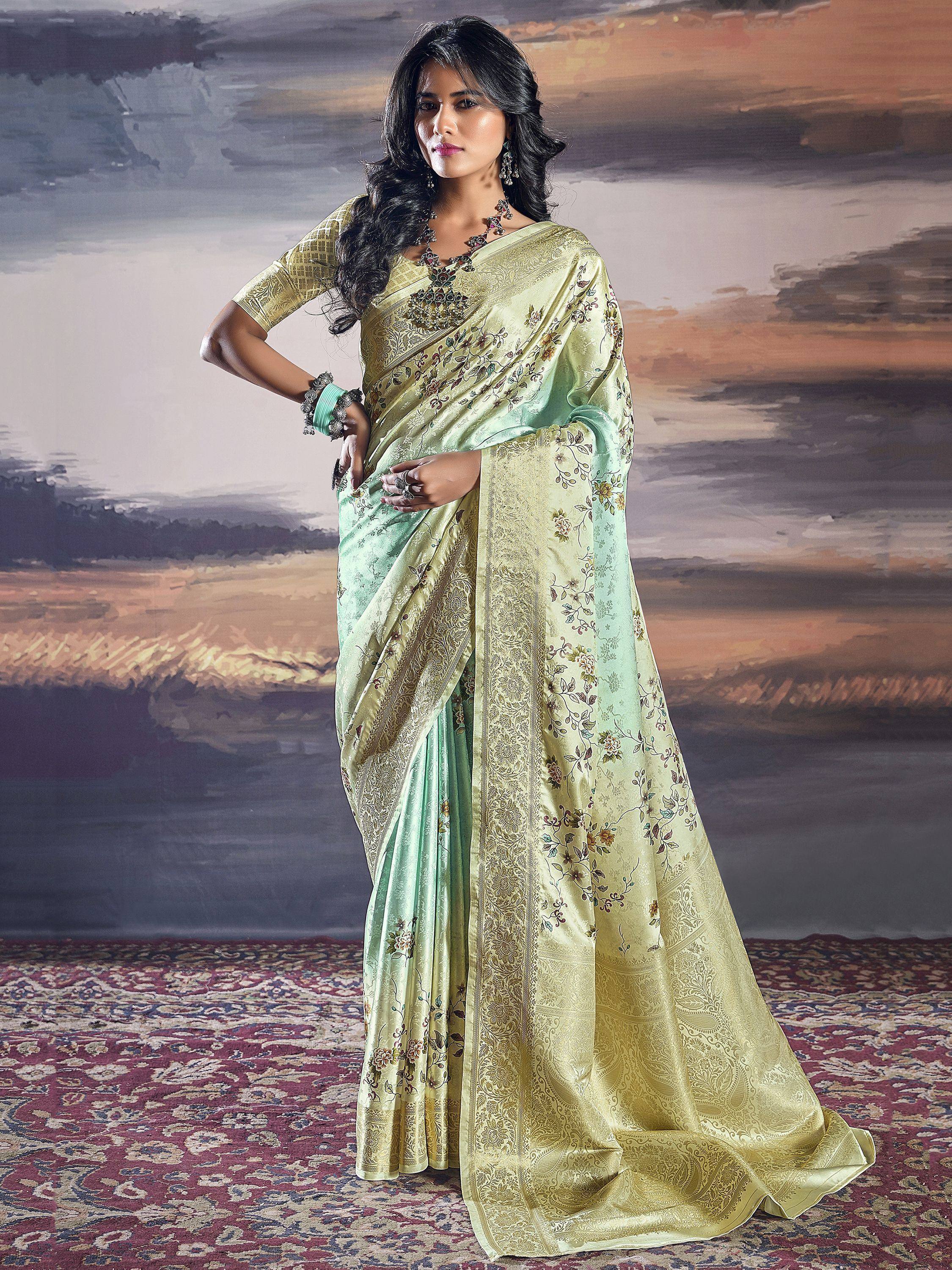 Elegant light green saree with floral embroidery and gold border, paired with matching blouse for Indian ethnic wear
