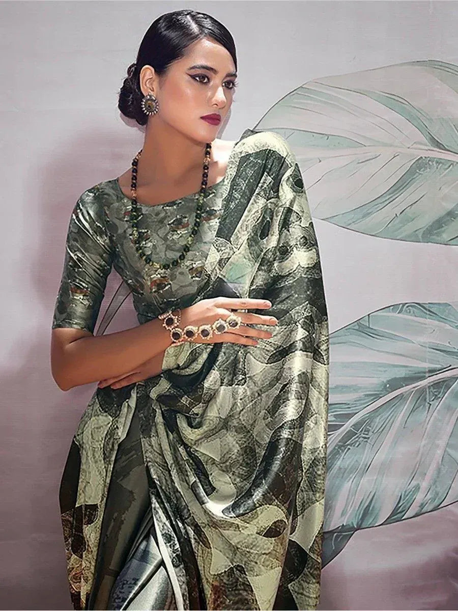 Elegant green printed saree with matching blouse, styled with statement jewelry for Indian ethnic wear