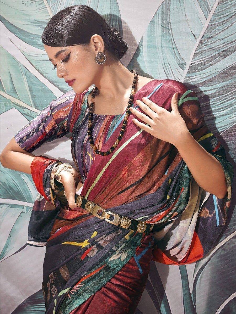 Stylish printed saree with belt, ethnic jewelry, and modern drape for Indian occasions