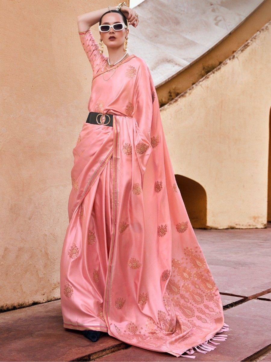 Pink silk saree with gold floral embroidery, styled with belt and sunglasses for modern ethnic look