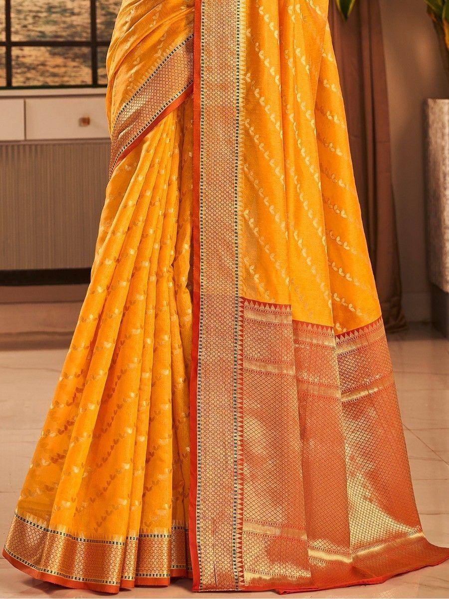 Yellow ethnic saree with intricate gold and orange border, perfect for Indian occasions