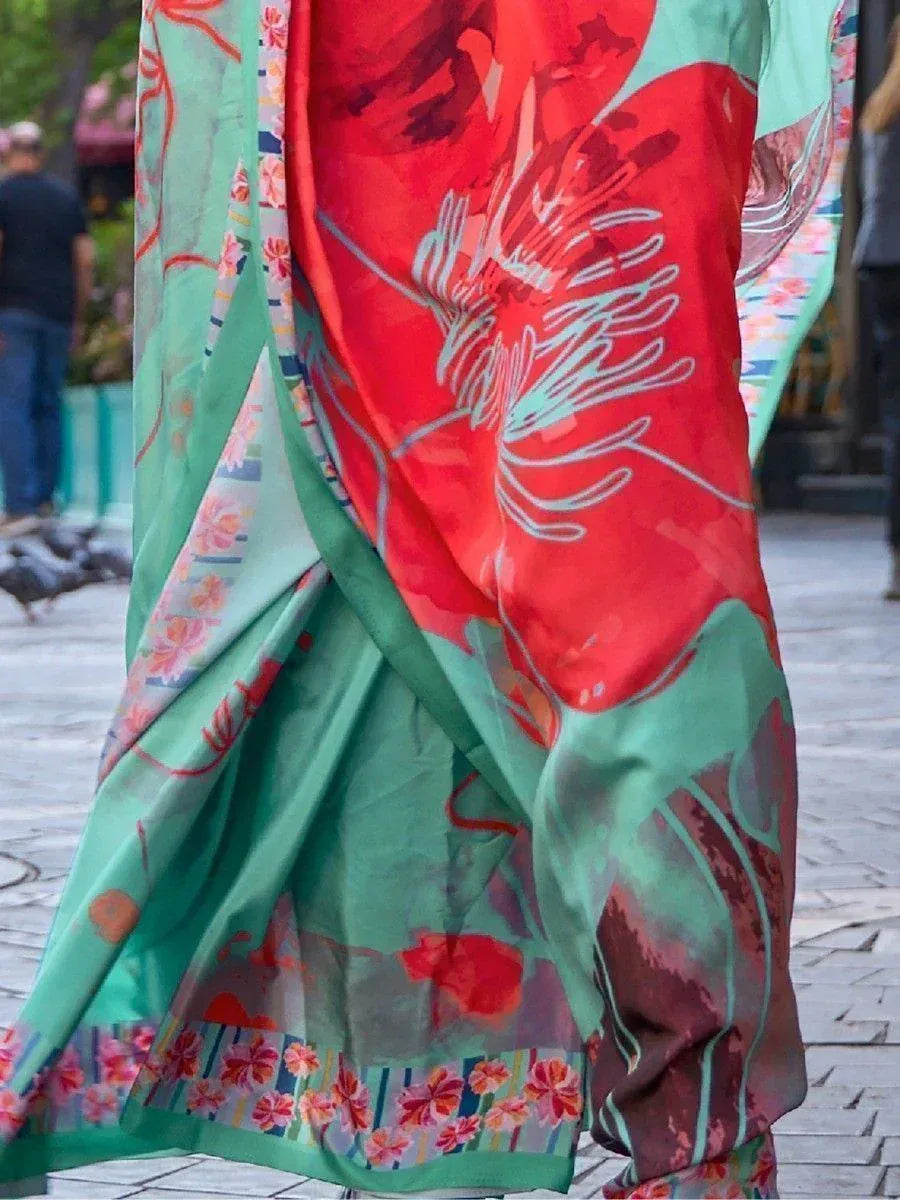 Vibrant red and mint green floral printed saree with elegant drape, perfect for ethnic occasions