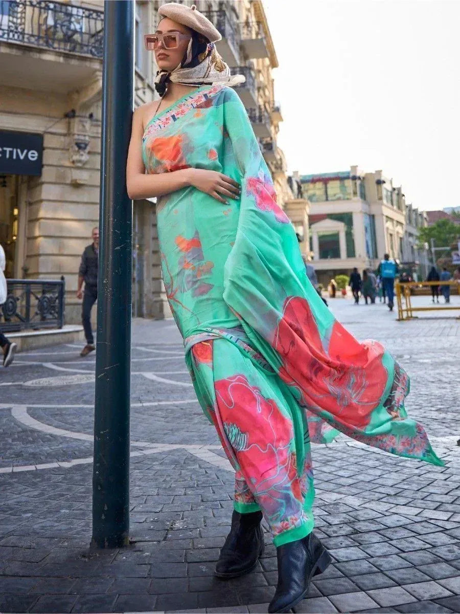 Woman in vibrant green floral ethnic gown with scarf, stylish sunglasses, and boots on city street