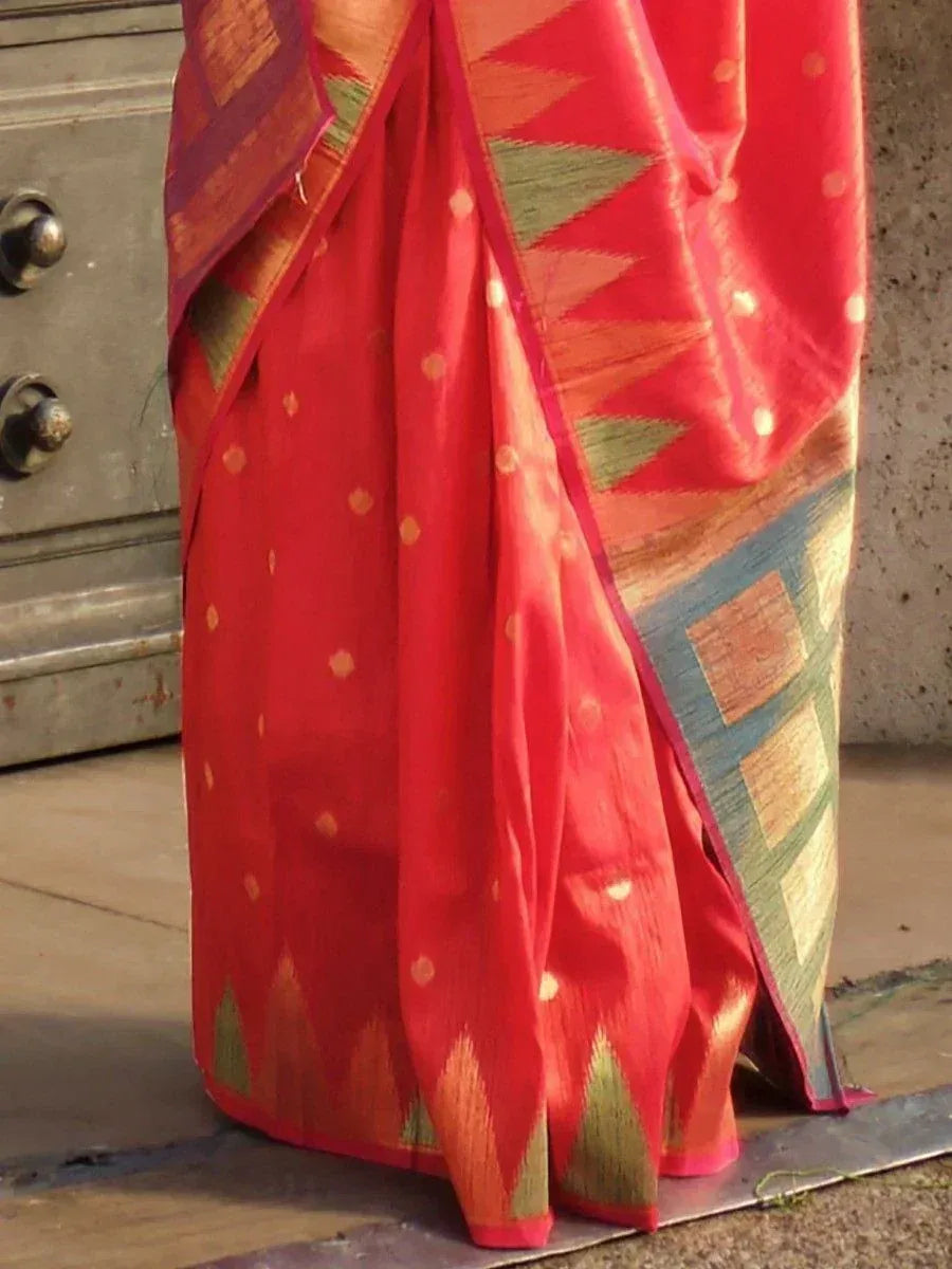 Red ethnic saree with geometric ikat patterns and gold dots, perfect for Indian festive wear