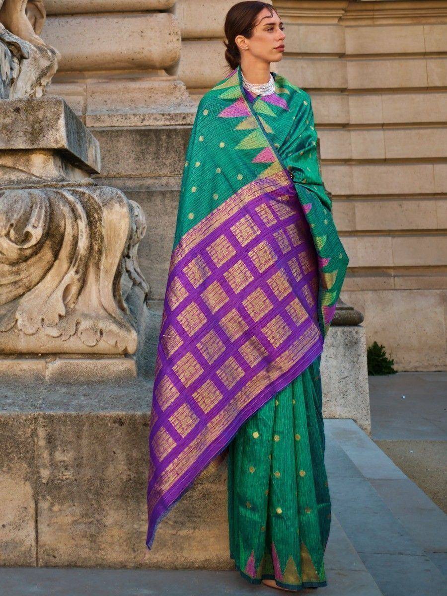Green and purple ethnic saree with geometric patterns, styled for traditional Indian wear