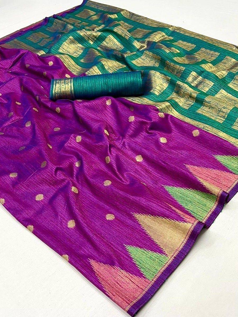 Vibrant purple and green designer saree with gold motifs and ikat border, perfect for ethnic occasions