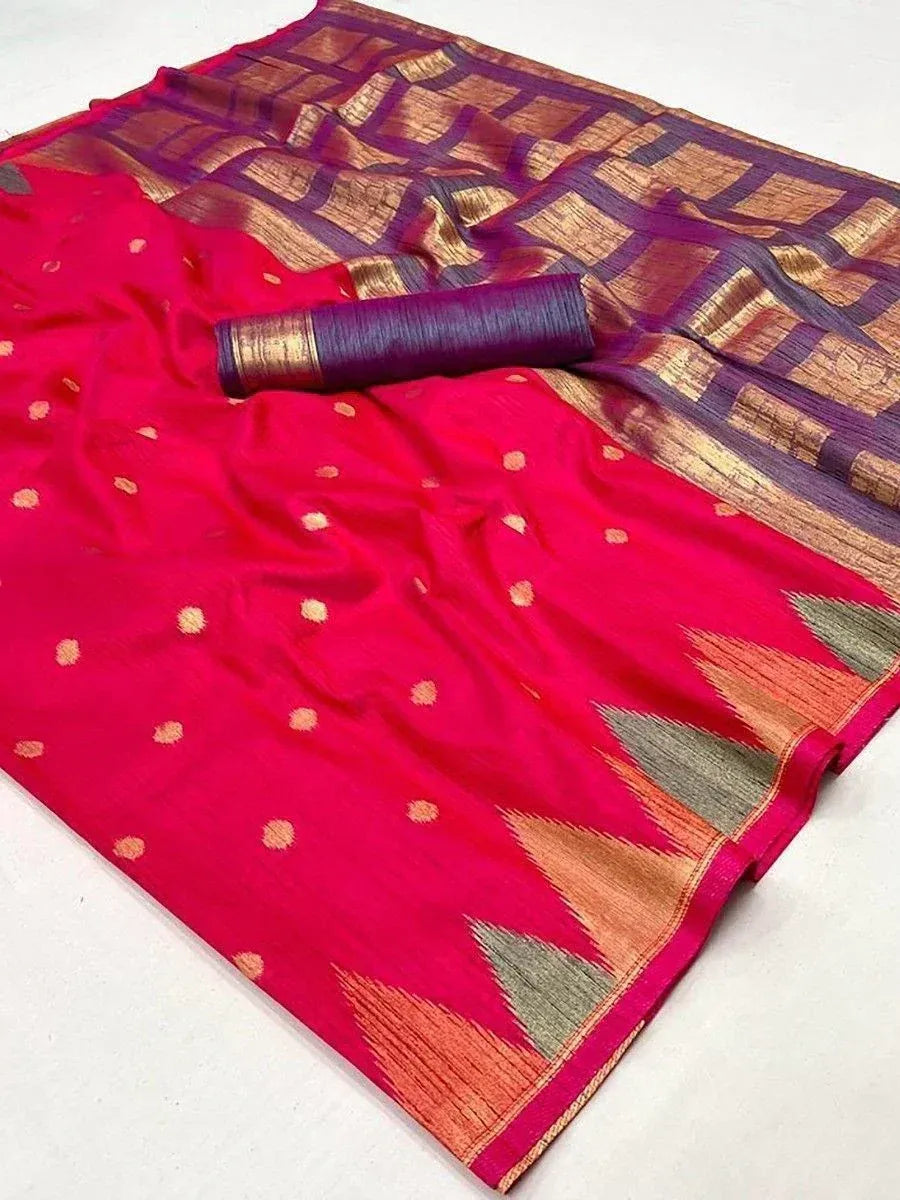 Vibrant red saree with gold polka dots and geometric border, paired with purple blouse piece, ideal for ethnic occasions.