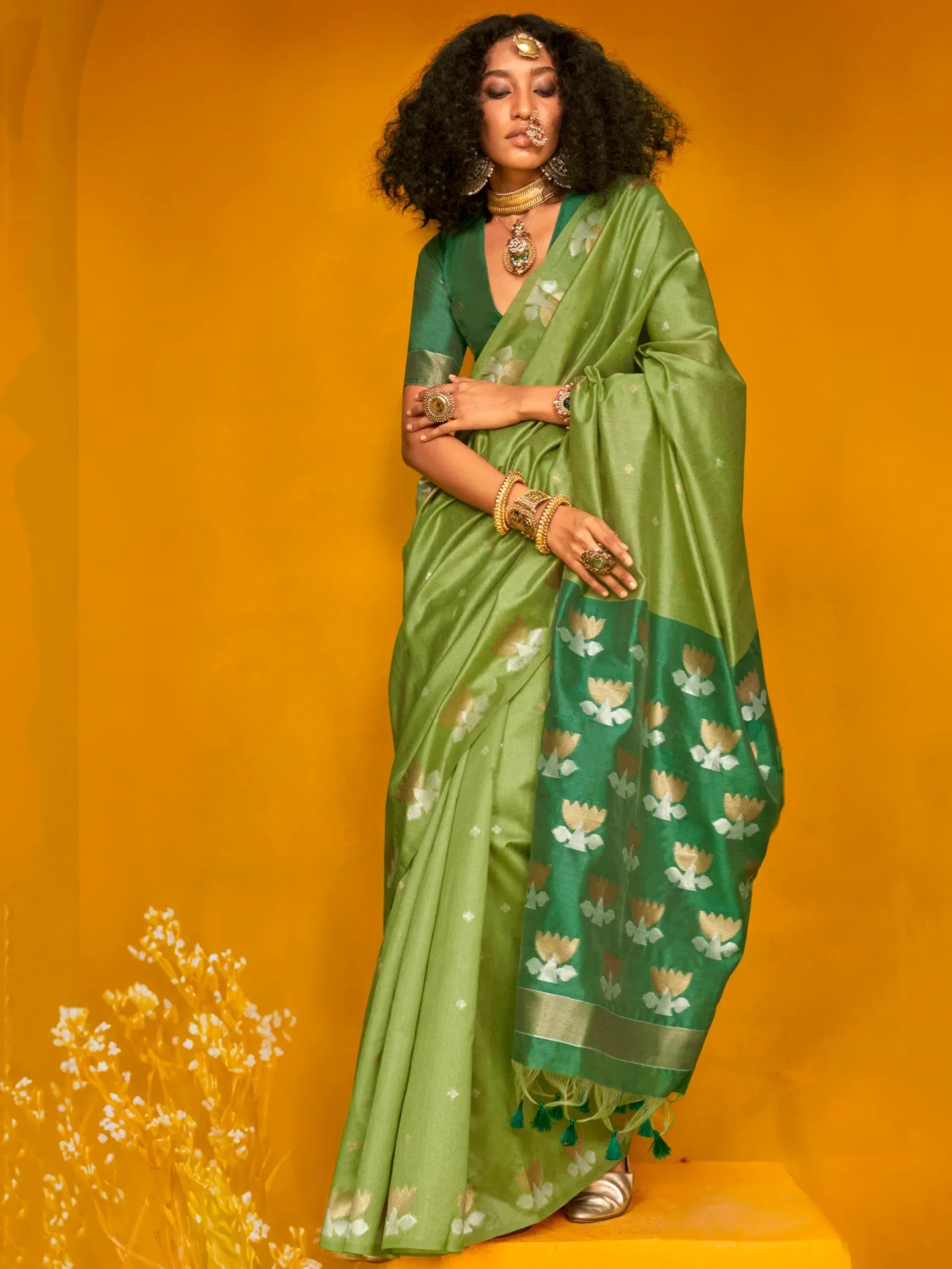 Green floral saree with gold accents, traditional Indian ethnic wear for women