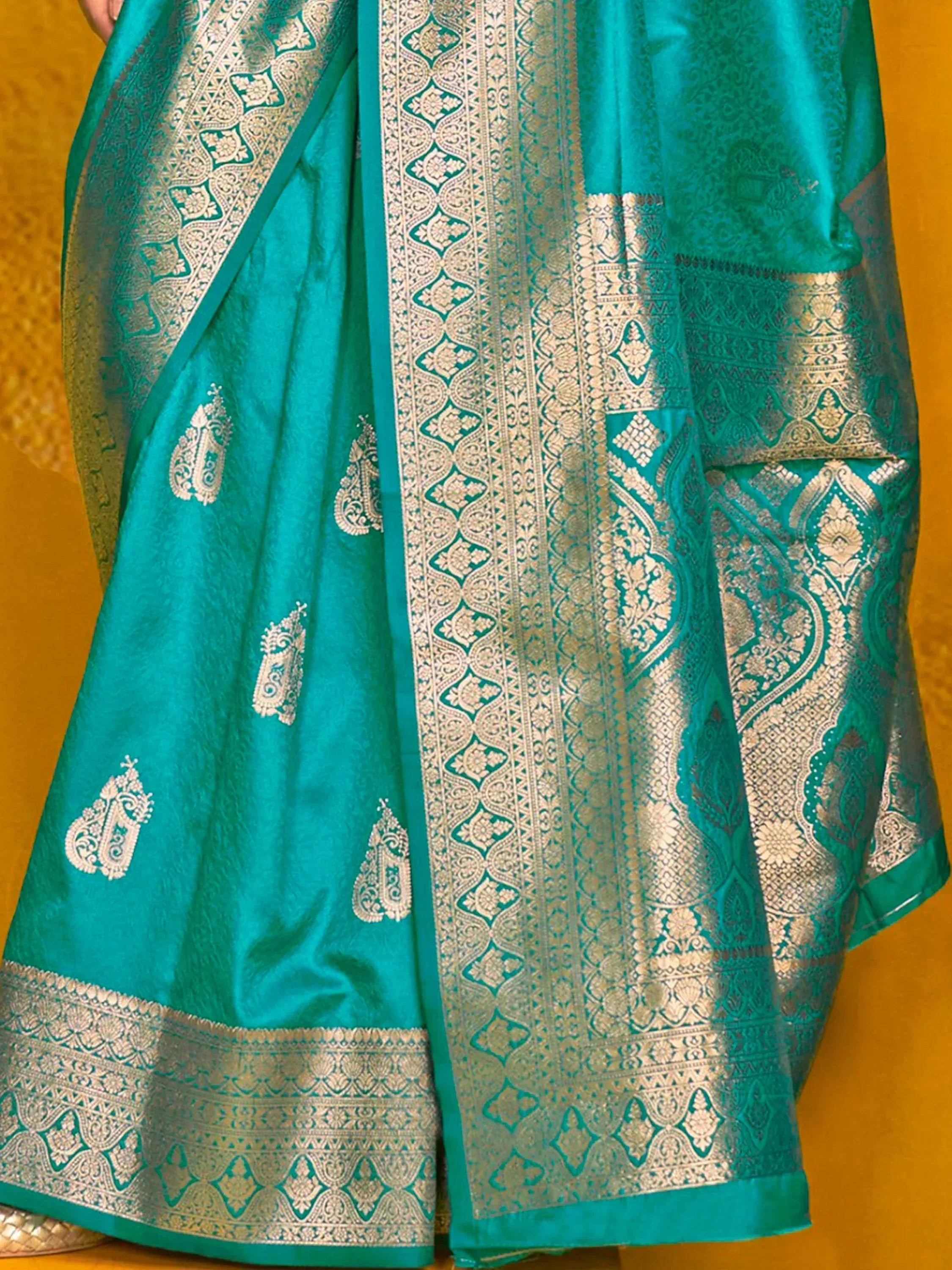Teal silk saree with gold zari border and paisley motifs, Indian ethnic wear