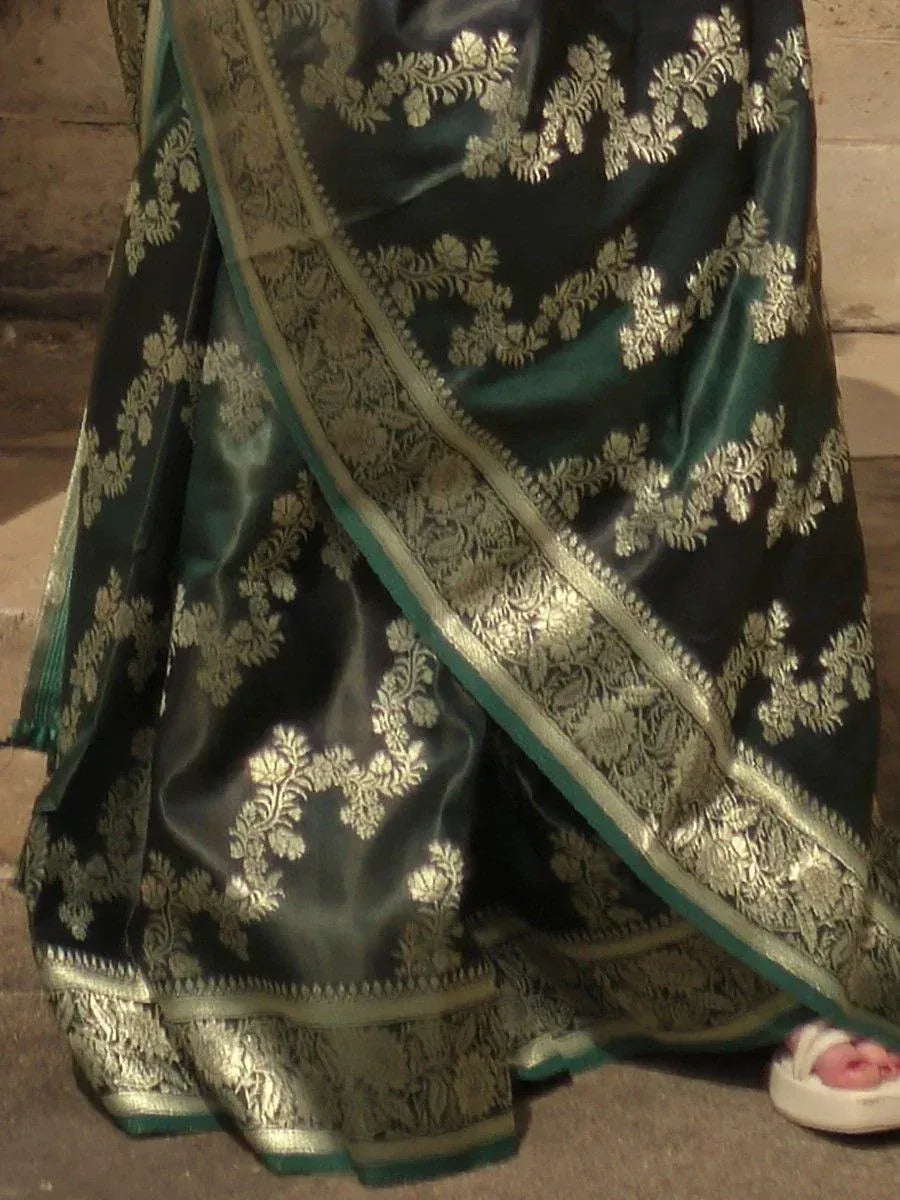 Dark green saree with gold floral embroidery and woven border, traditional Indian ethnic wear