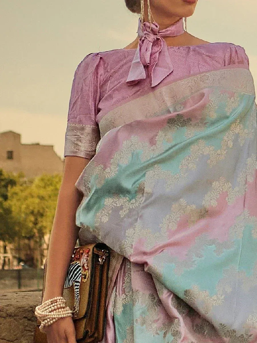 Pastel pink and mint green designer saree with floral jacquard, paired with matching blouse and pearl accessories