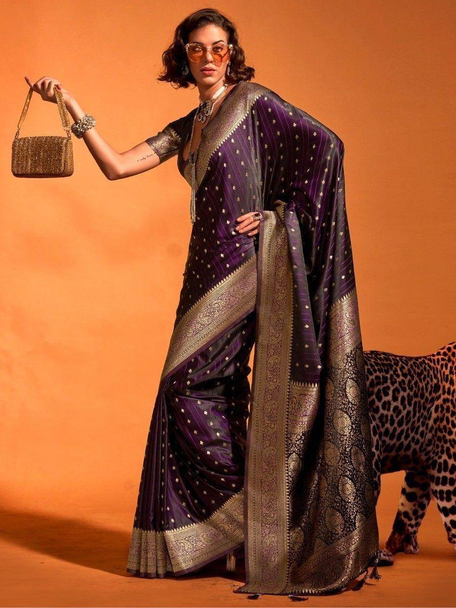 Purple designer saree with gold embroidery, perfect for ethnic wear and festive occasions.