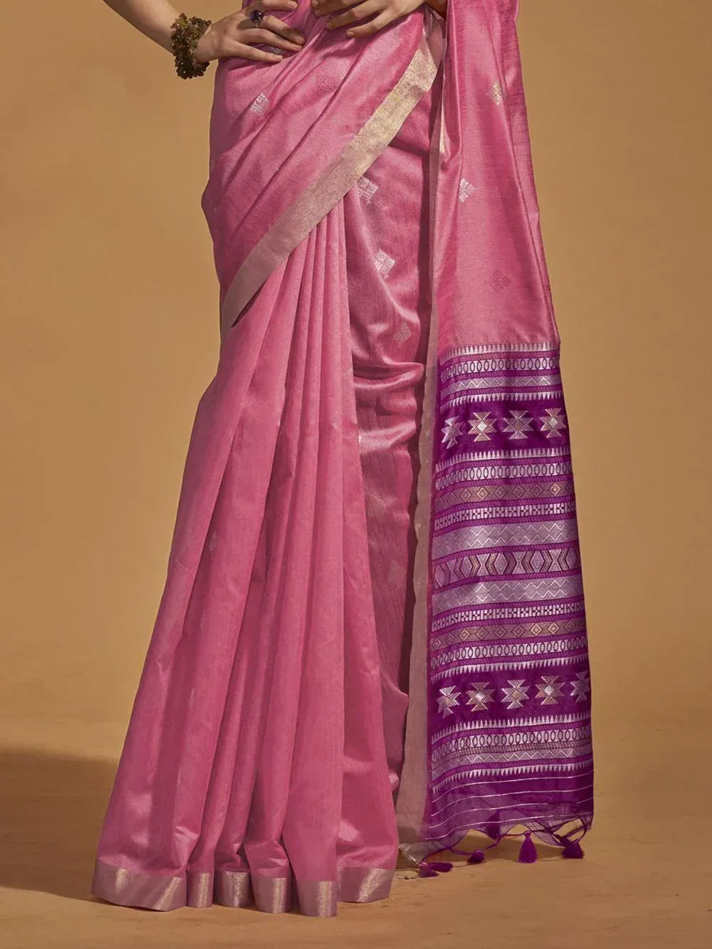 Pink ethnic saree with purple geometric border, perfect for Indian occasions and festive wear