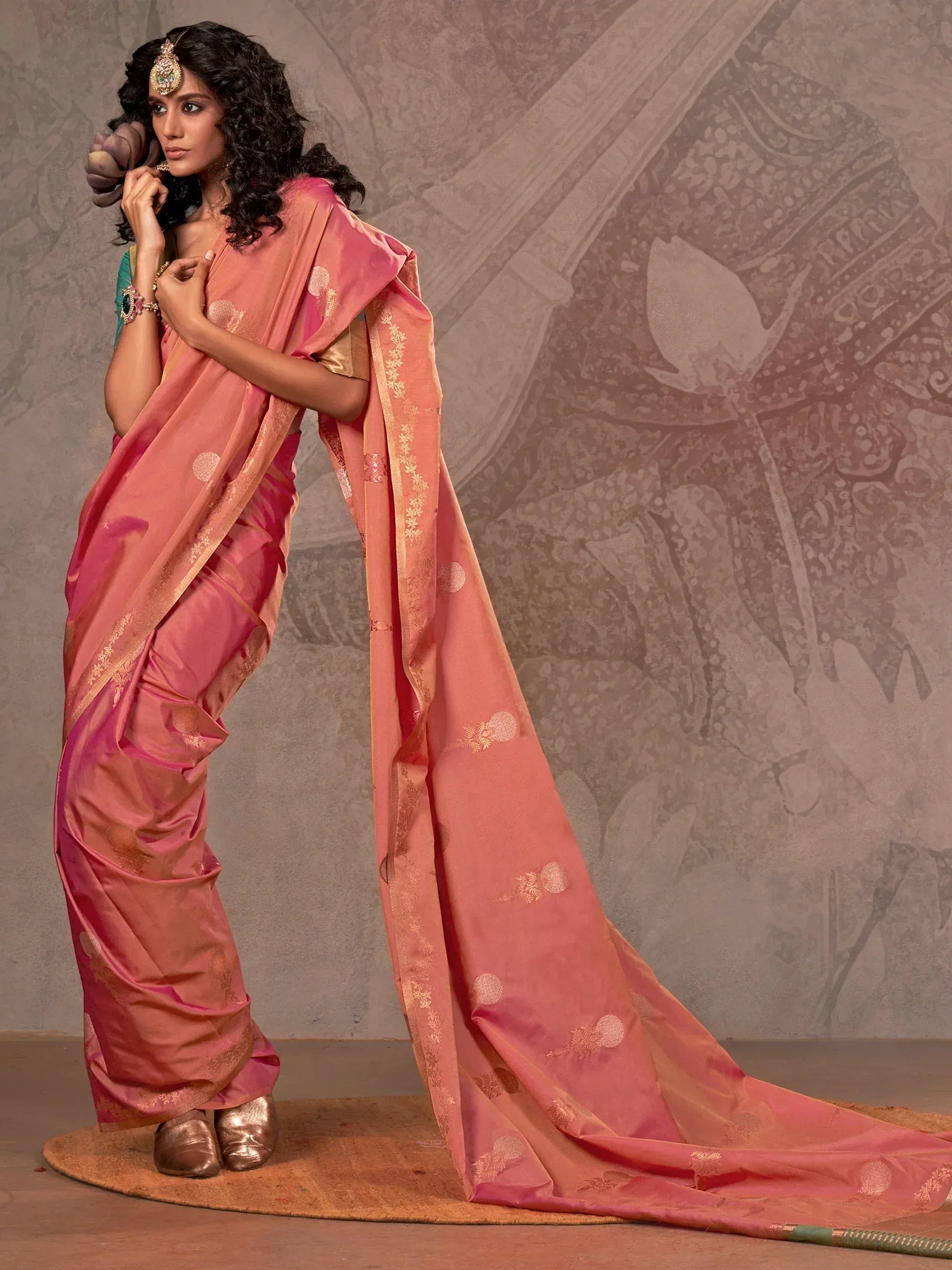 Pink designer saree with gold embroidery, perfect for Indian ethnic wear and festive occasions.