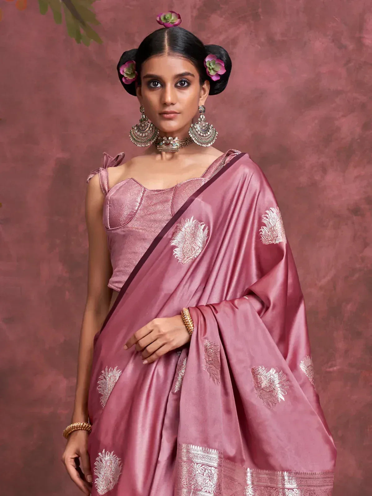 Pink silk saree with silver embroidery, paired with designer blouse and traditional jewelry for ethnic wear