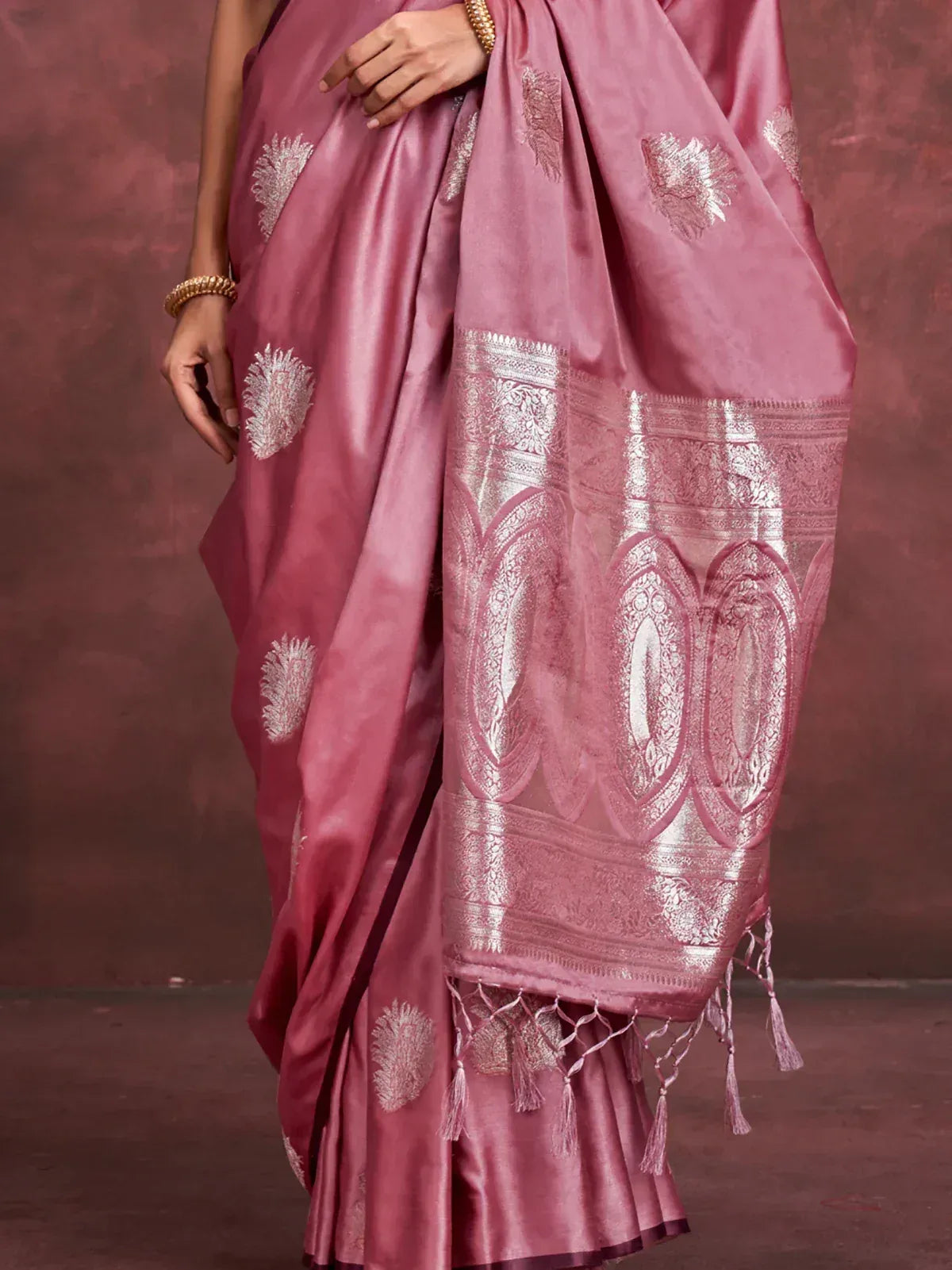 Pink silk saree with silver zari work and tassels, elegant Indian ethnic wear