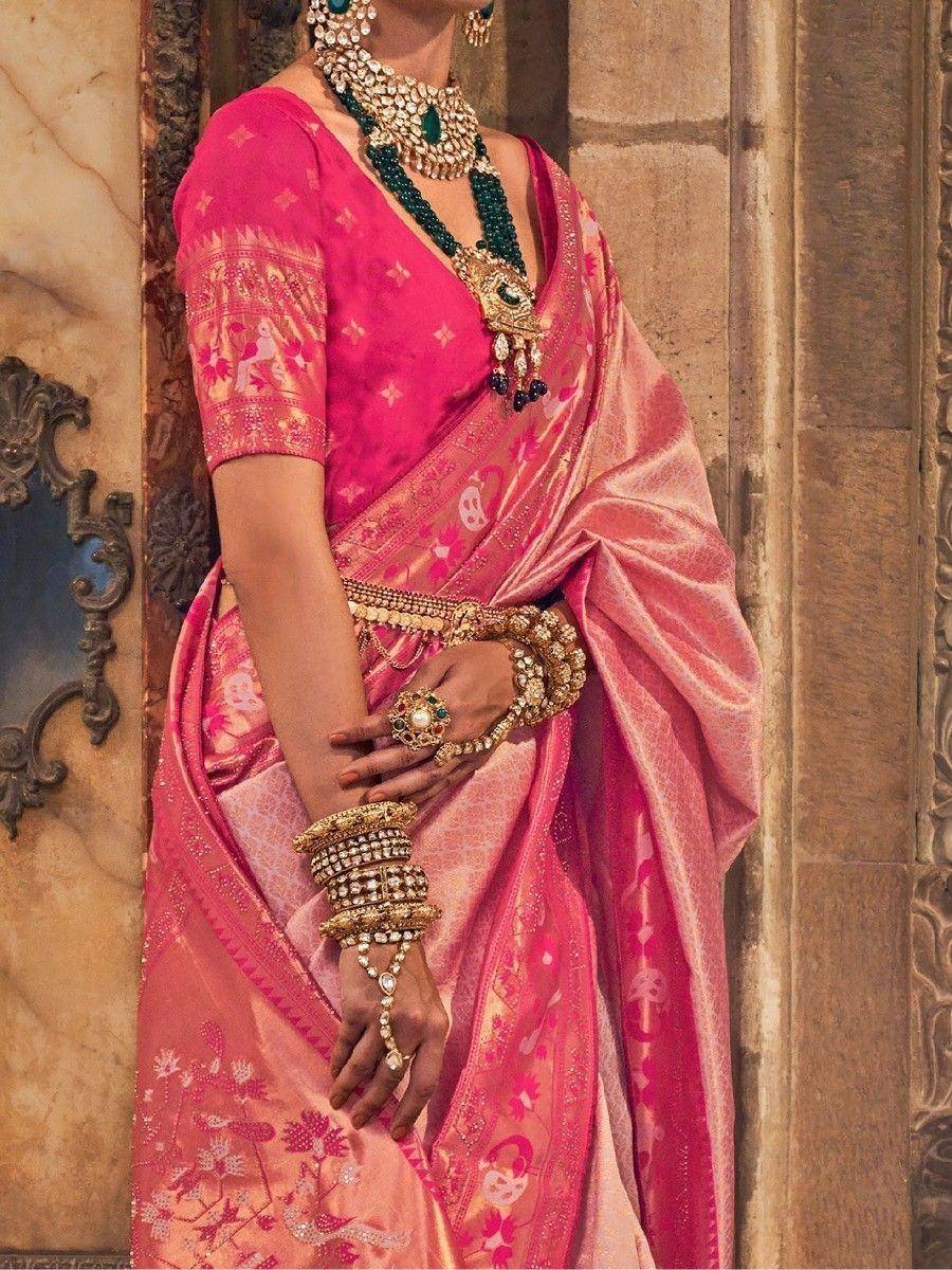 Pink floral saree with gold embroidery, traditional Indian ethnic wear, adorned with heavy jewelry