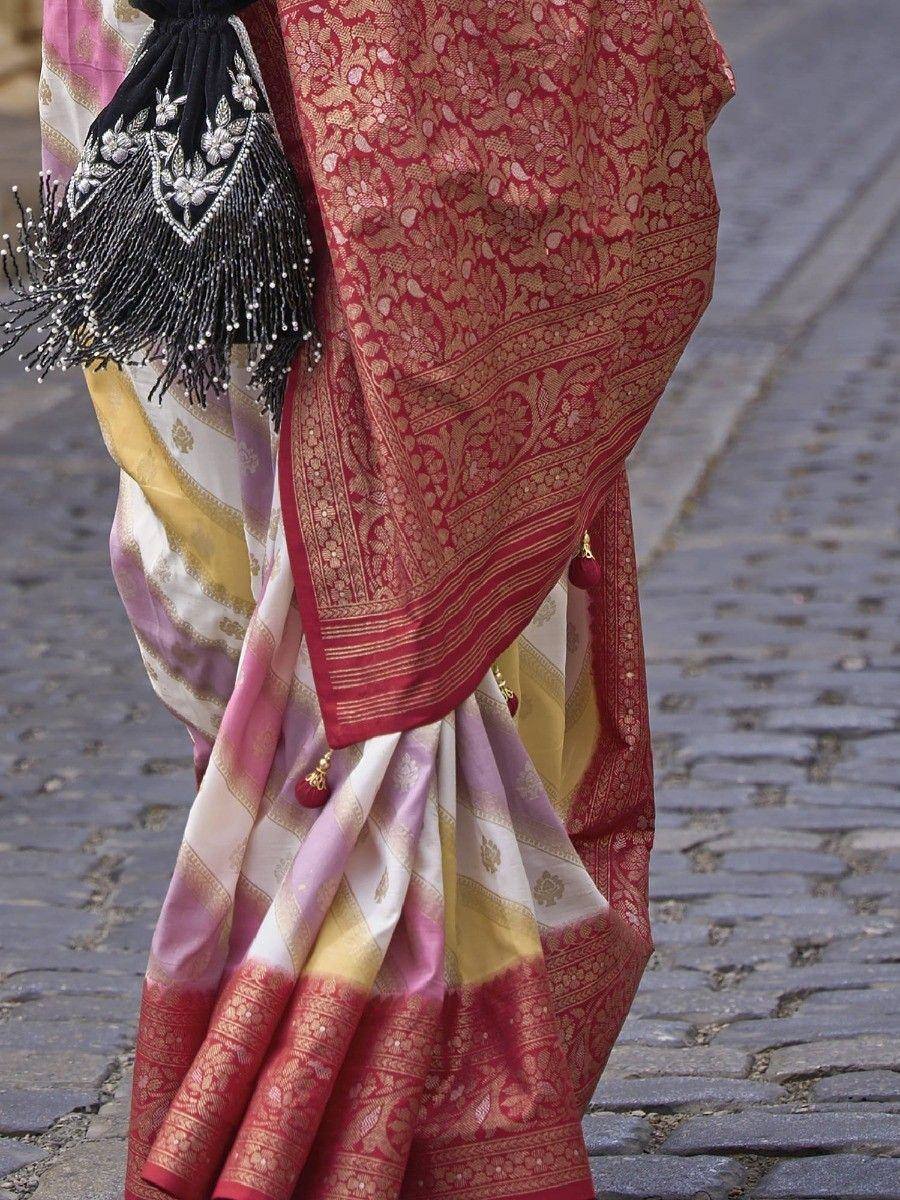 Elegant Indian saree with red gold brocade border, pastel stripes, and black beaded blouse, perfect for ethnic occasions