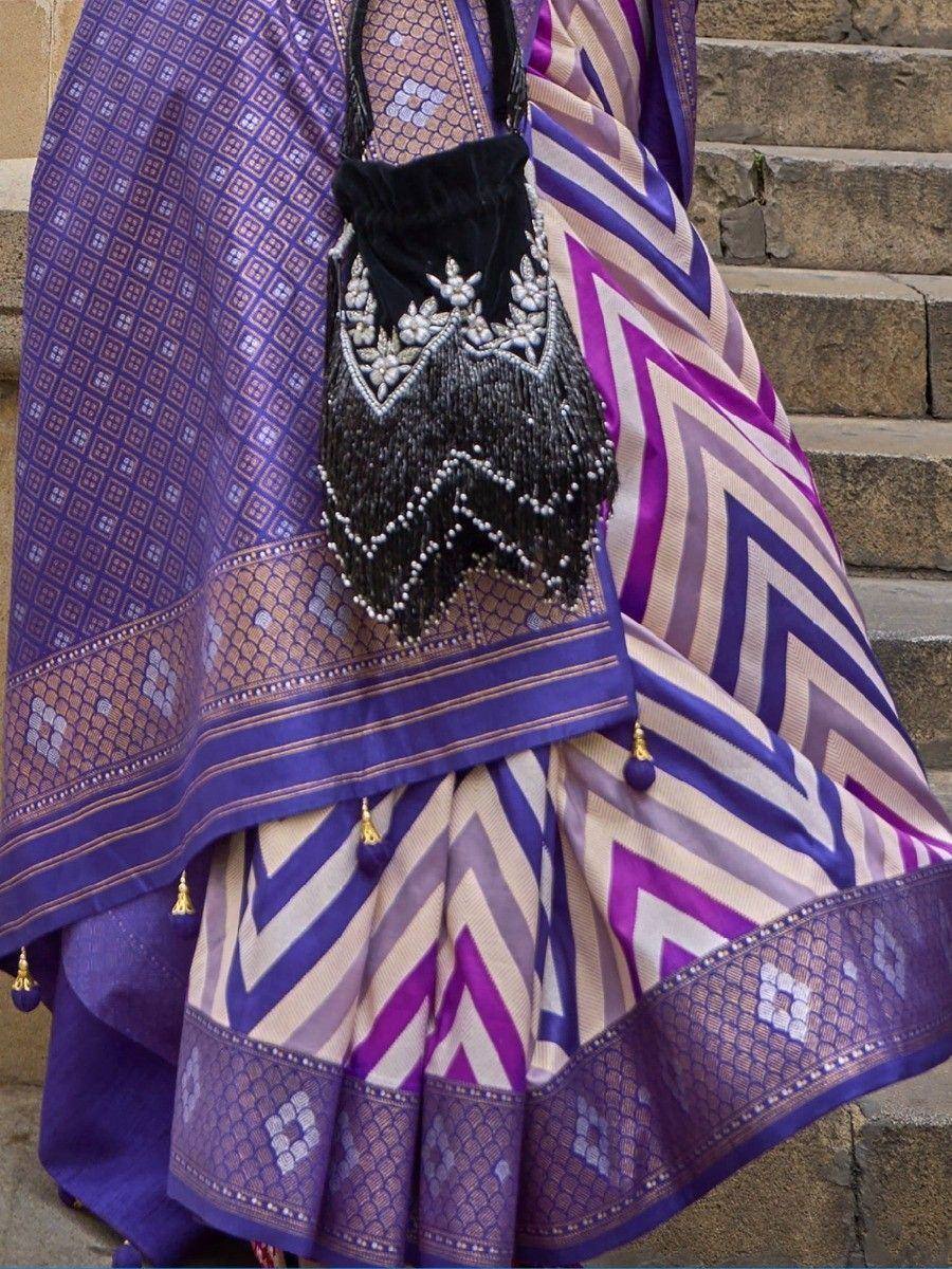 Purple and cream chevron pattern lehenga with embroidered black potli bag, ethnic Indian wear
