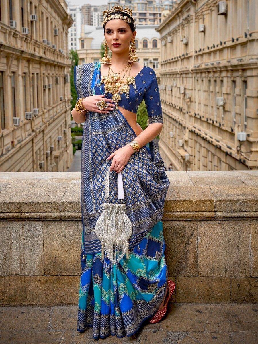 Blue and teal designer saree with gold jewelry, perfect for Indian ethnic wear occasions