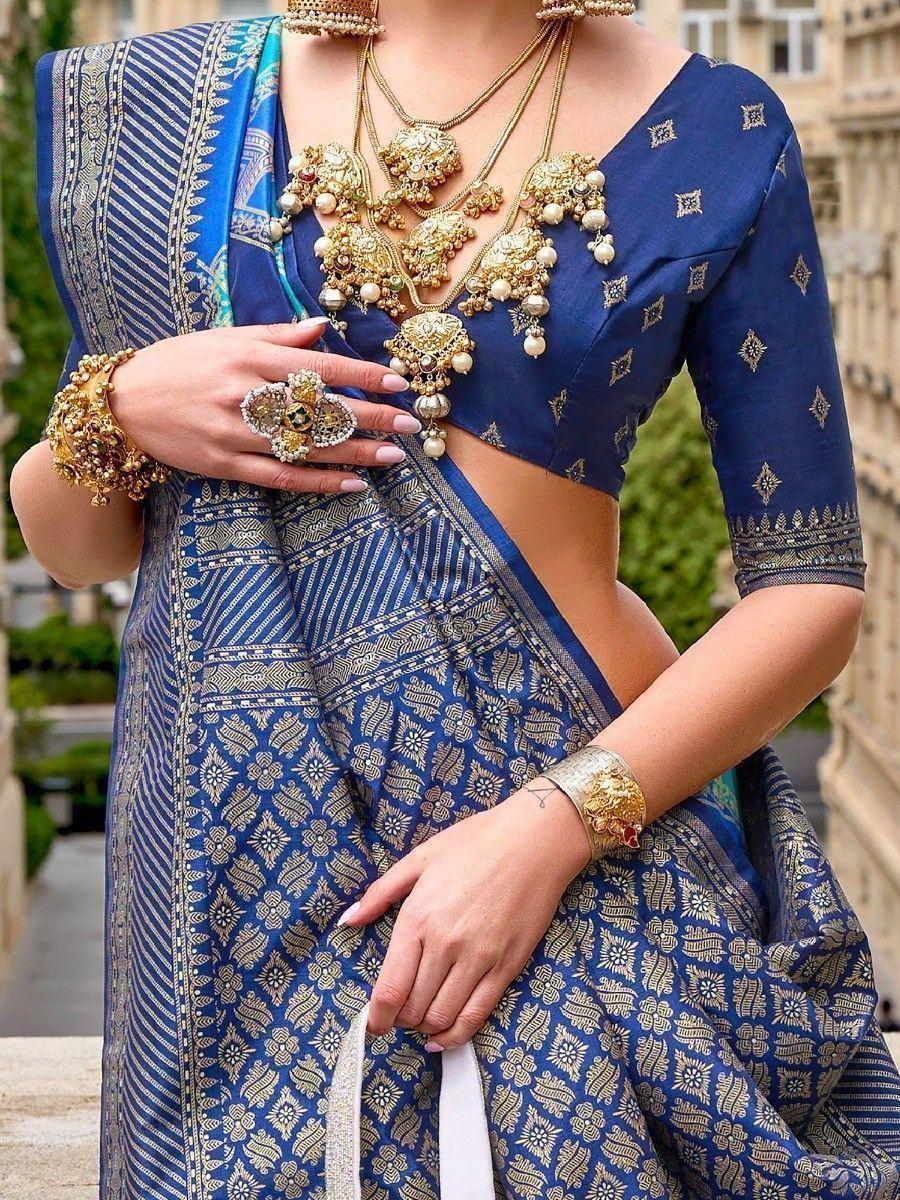 Blue embroidered saree with gold jewelry, perfect for Indian ethnic wear occasions