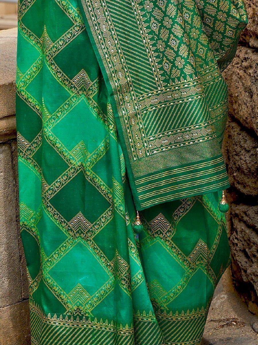 Emerald green ethnic saree with gold geometric and floral embroidery, perfect for Indian weddings and festive occasions.
