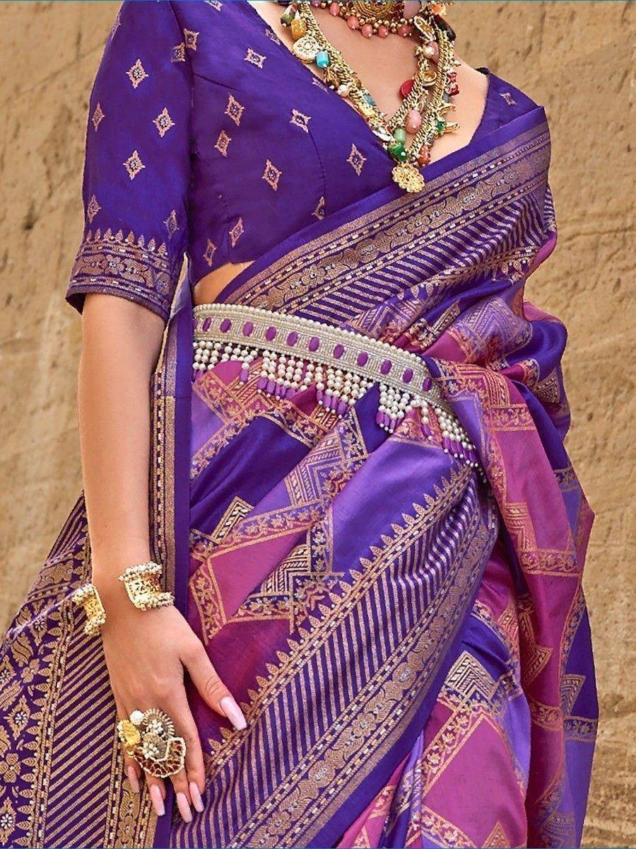Purple and pink designer saree with gold embroidery, traditional jewelry, and ethnic blouse for festive occasions