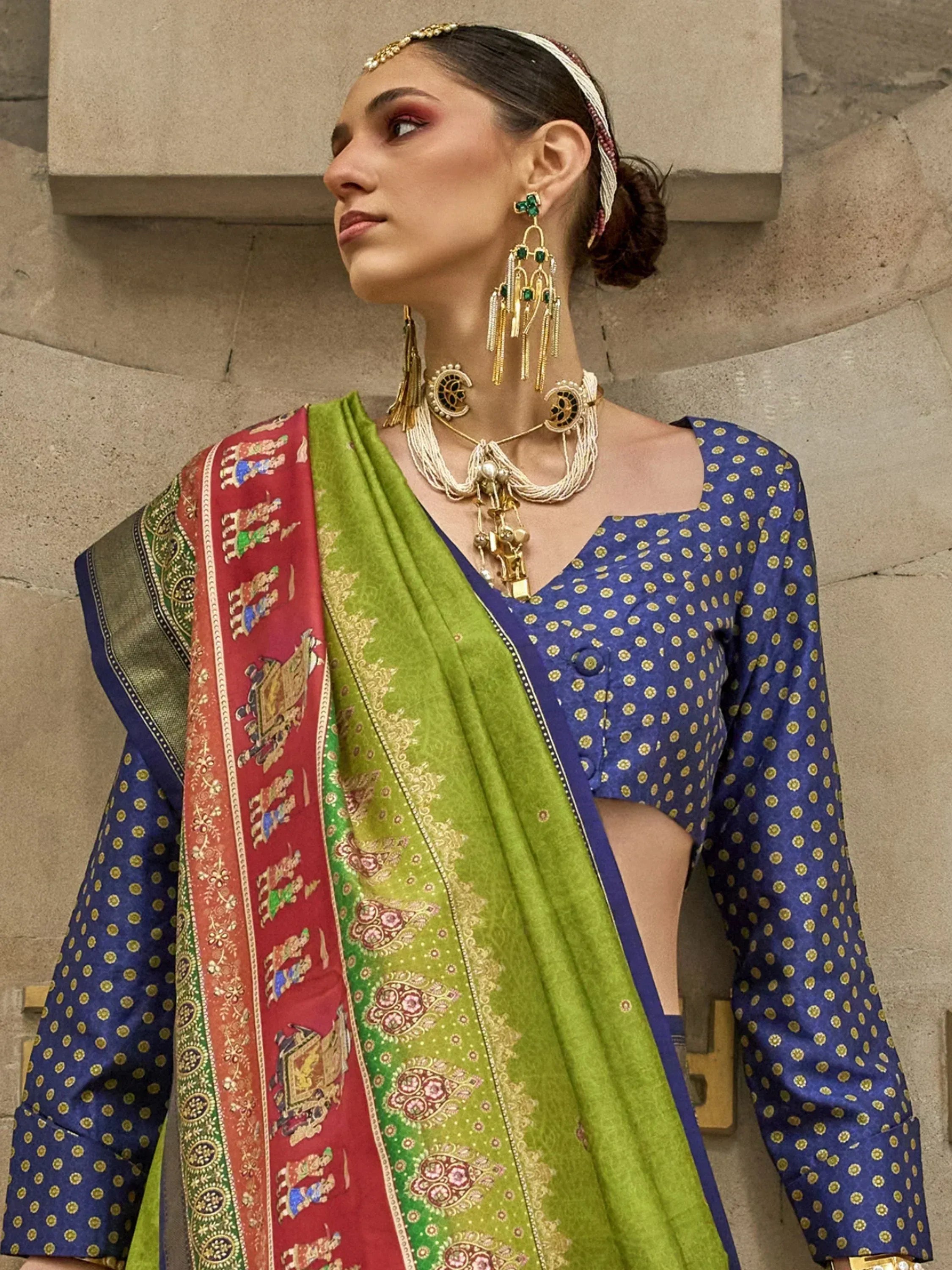 Woman in blue polka dot kurta with green and red embroidered dupatta, traditional Indian ethnic wear