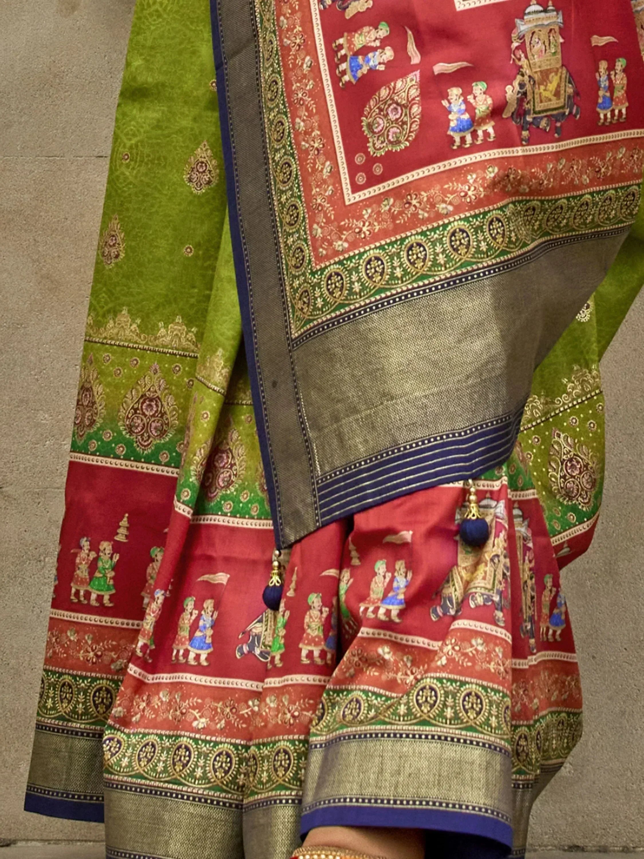 Red and green designer lehenga choli with intricate temple and folk art print, perfect for ethnic occasions.