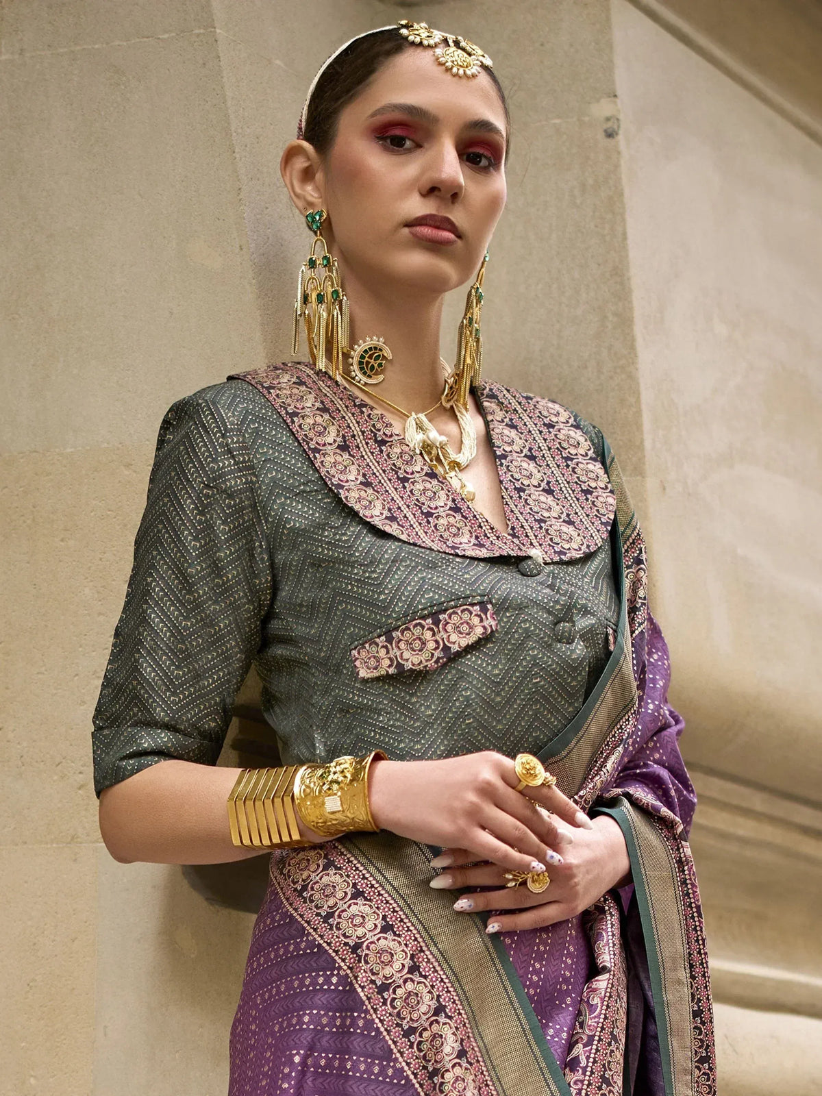 Woman in elegant Indian ethnic saree with gold jewelry, perfect for festive occasions and traditional events.