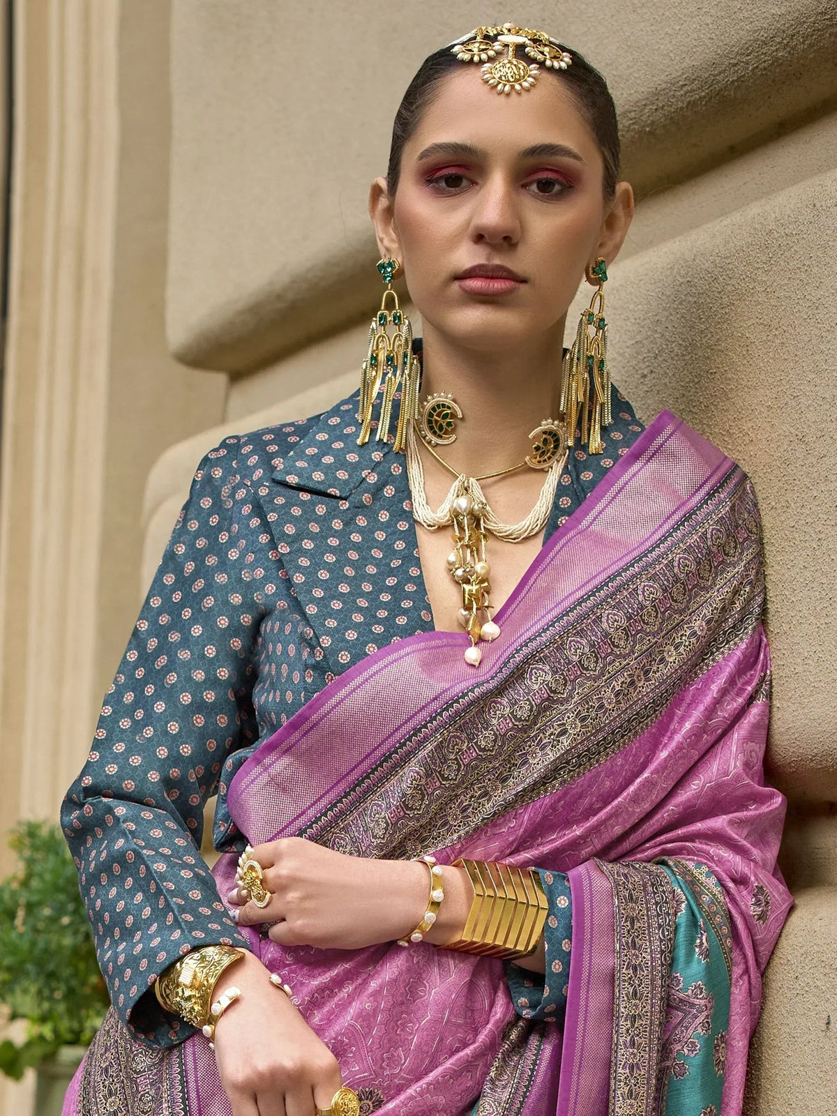 Woman in purple saree with gold jewelry, Indian ethnic wear, designer blouse, traditional accessories