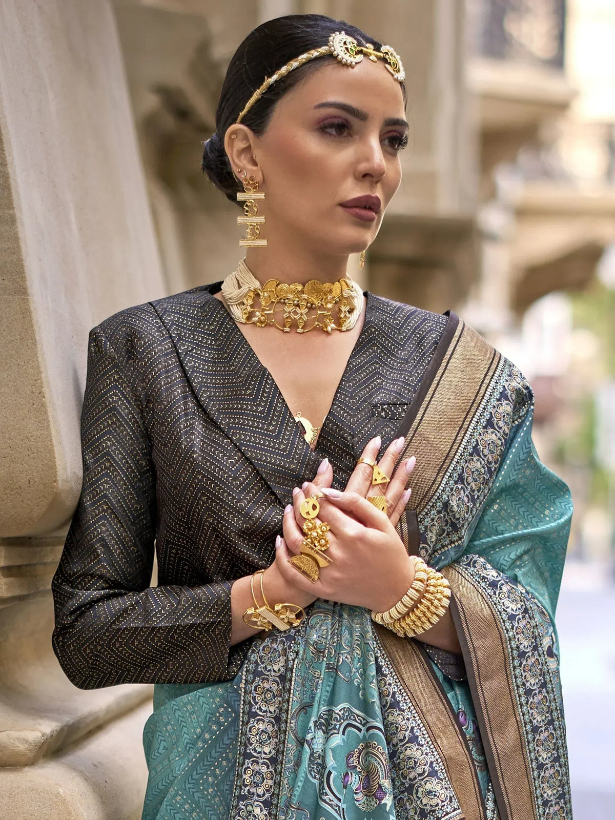Elegant woman in traditional Indian saree with gold jewelry, perfect for ethnic wear occasions