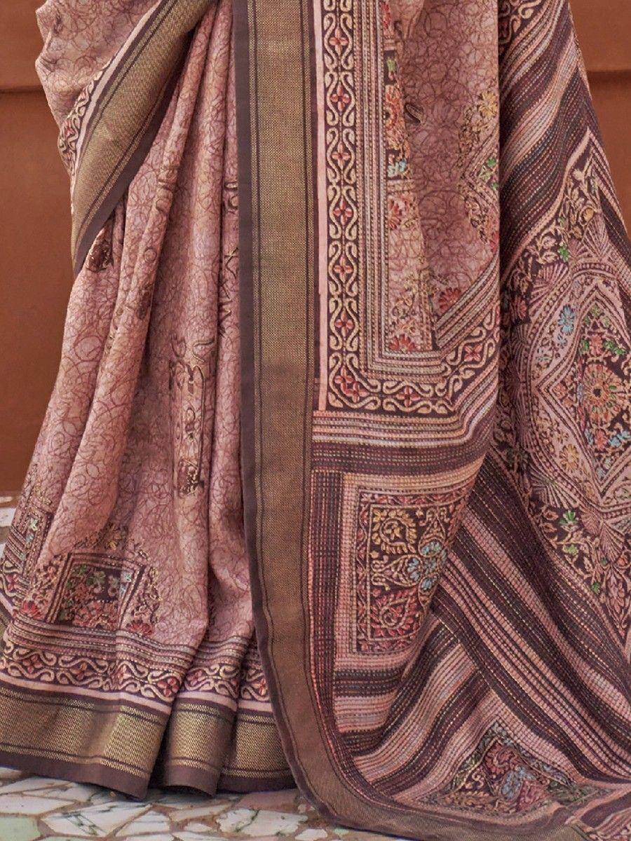 Elegant Indian saree with intricate floral and geometric patterns in earthy tones, perfect for ethnic wear.