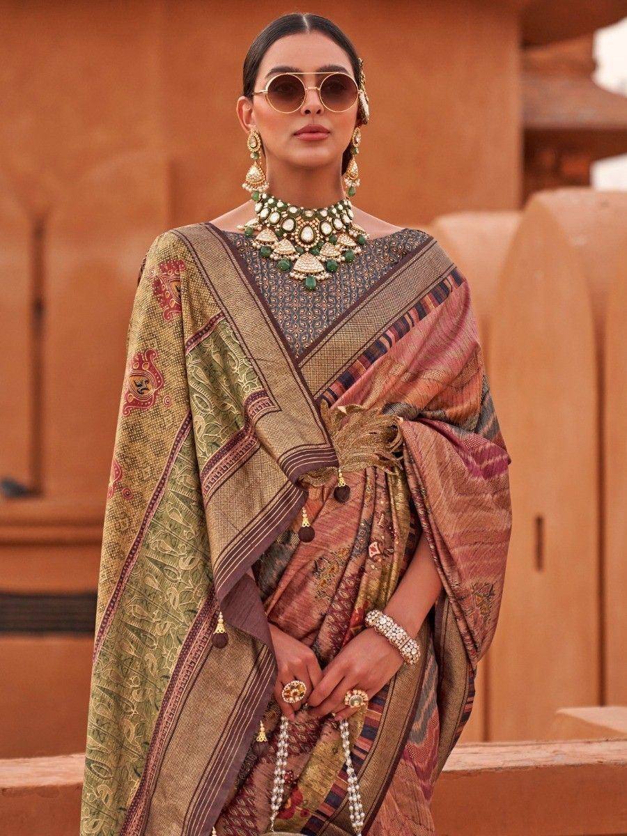 Elegant Indian saree with intricate embroidery, paired with traditional jewelry and sunglasses, perfect for ethnic occasions.