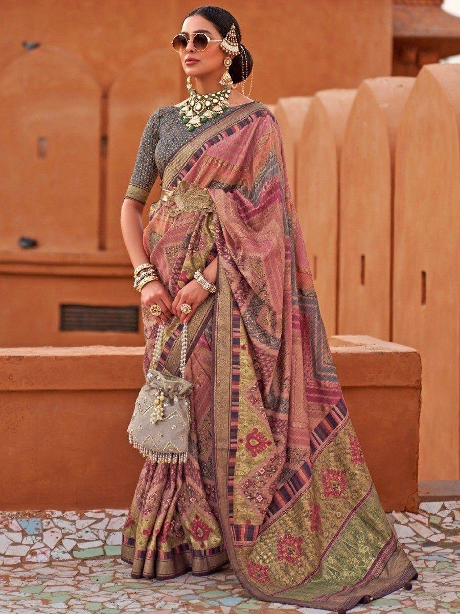 Woman in designer saree with intricate patterns, ethnic jewelry, and sunglasses, styled for Indian ethnic wear
