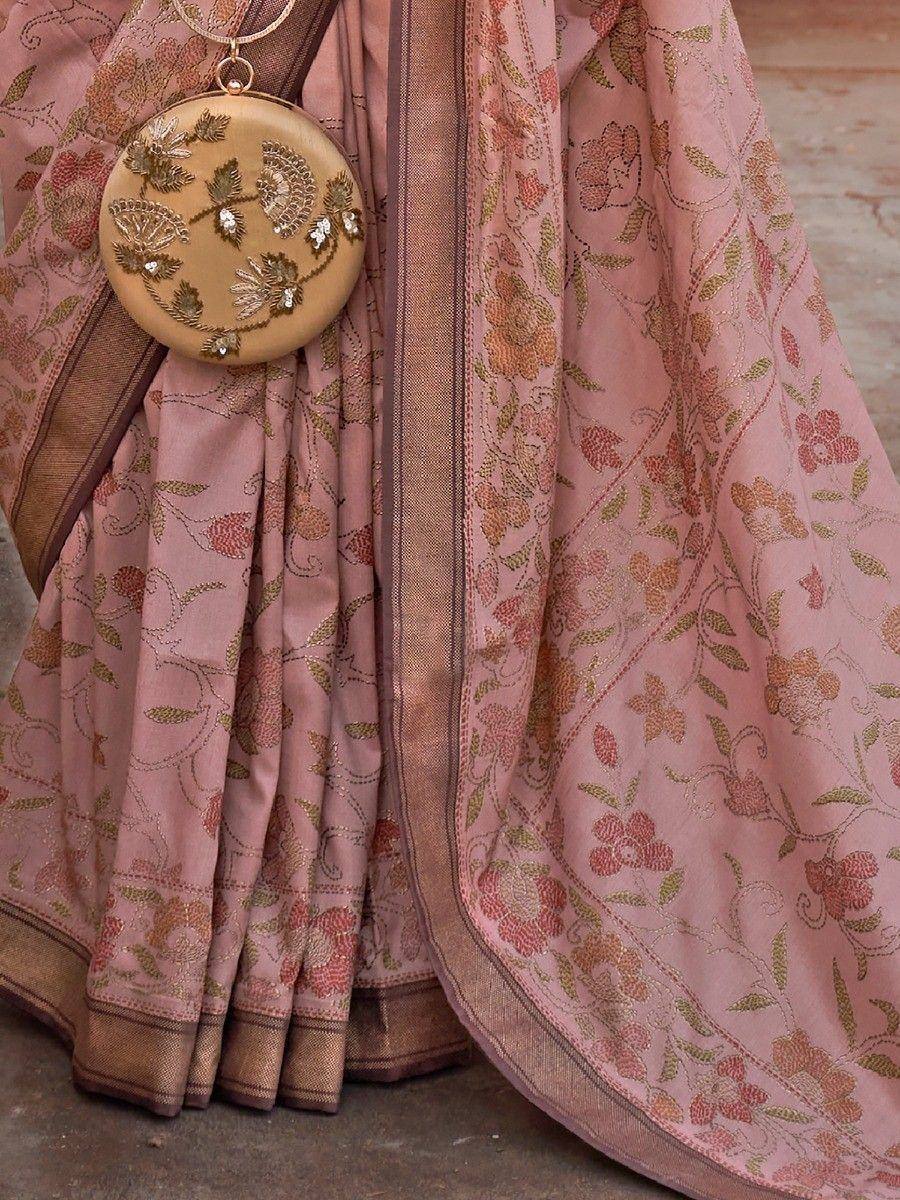 Pink floral embroidered saree with gold border and matching embellished clutch